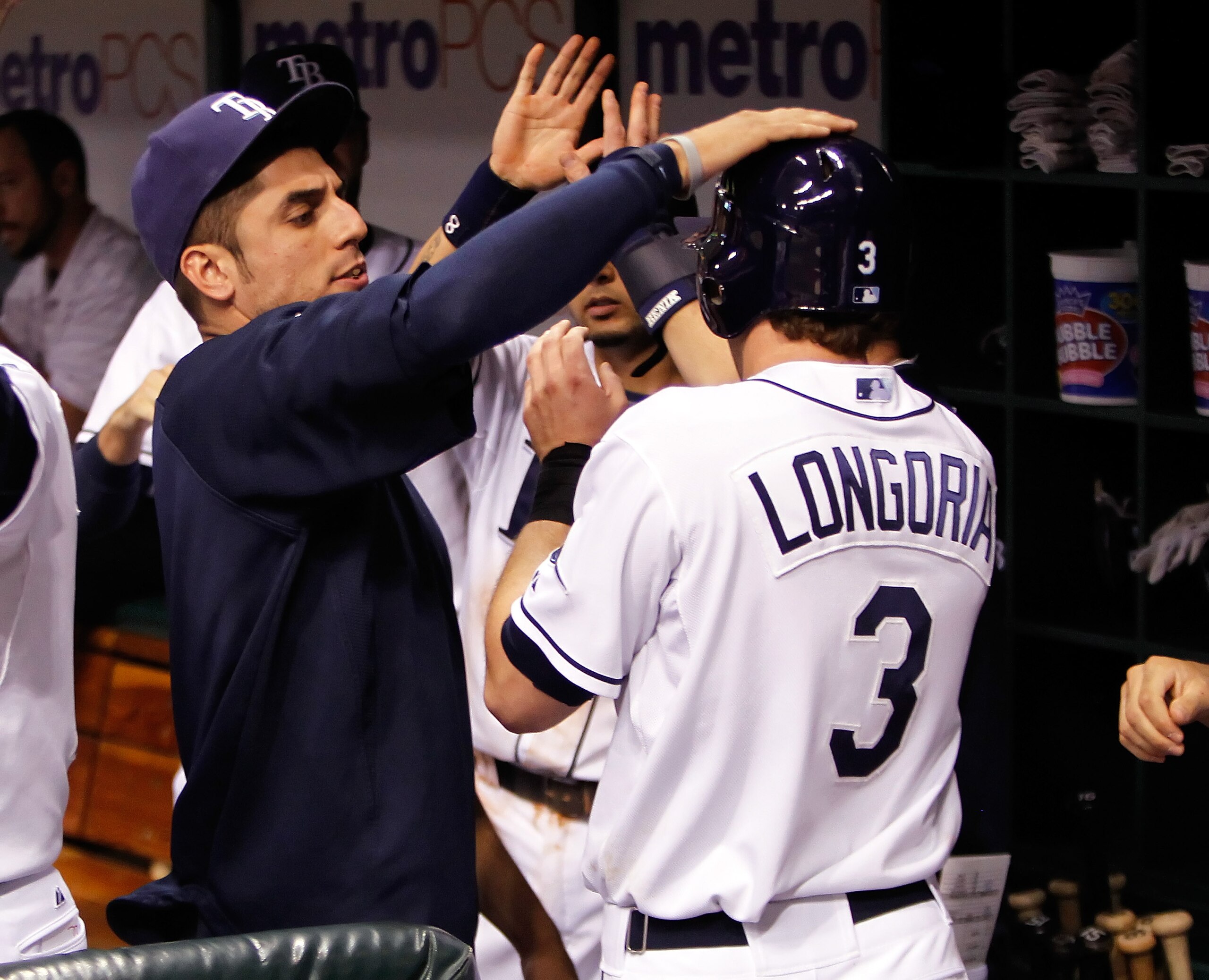 ST PETERSBURG, FL - AUGUST 04:  Infielder Evan Longoria #3 of the Tampa Bay Rays is congratulated by pitcher Matt Garza #22 after scoring a run in the ninth against the Minnesota Twins during the game at Tropicana Field on August 4, 2010 in St. Petersburg