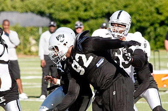 Richard Seymour puts the moves on  Khalif Barnes in camp.