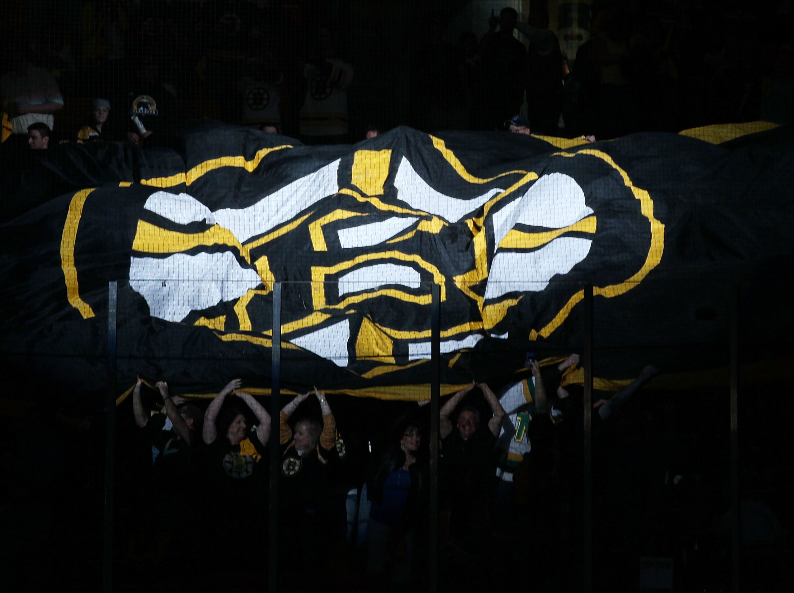 BOSTON - MAY 14: Fans pass a giant flag before the Boston Bruins take on the Philadelphia Flyers in Game Seven of the Eastern Conference Semifinals during the 2010 NHL Stanley Cup Playoffs at TD Garden on May 14, 2010 in Boston, Massachusetts. (Photo by BOSTON - MAY 14: Fans pass a giant flag before the Boston Bruins take on the Philadelphia Flyers in Game Seven of the Eastern Conference Semifinals during the 2010 NHL Stanley Cup Playoffs at TD Garden on May 14, 2010 in Boston, Massachusetts. (Photo by