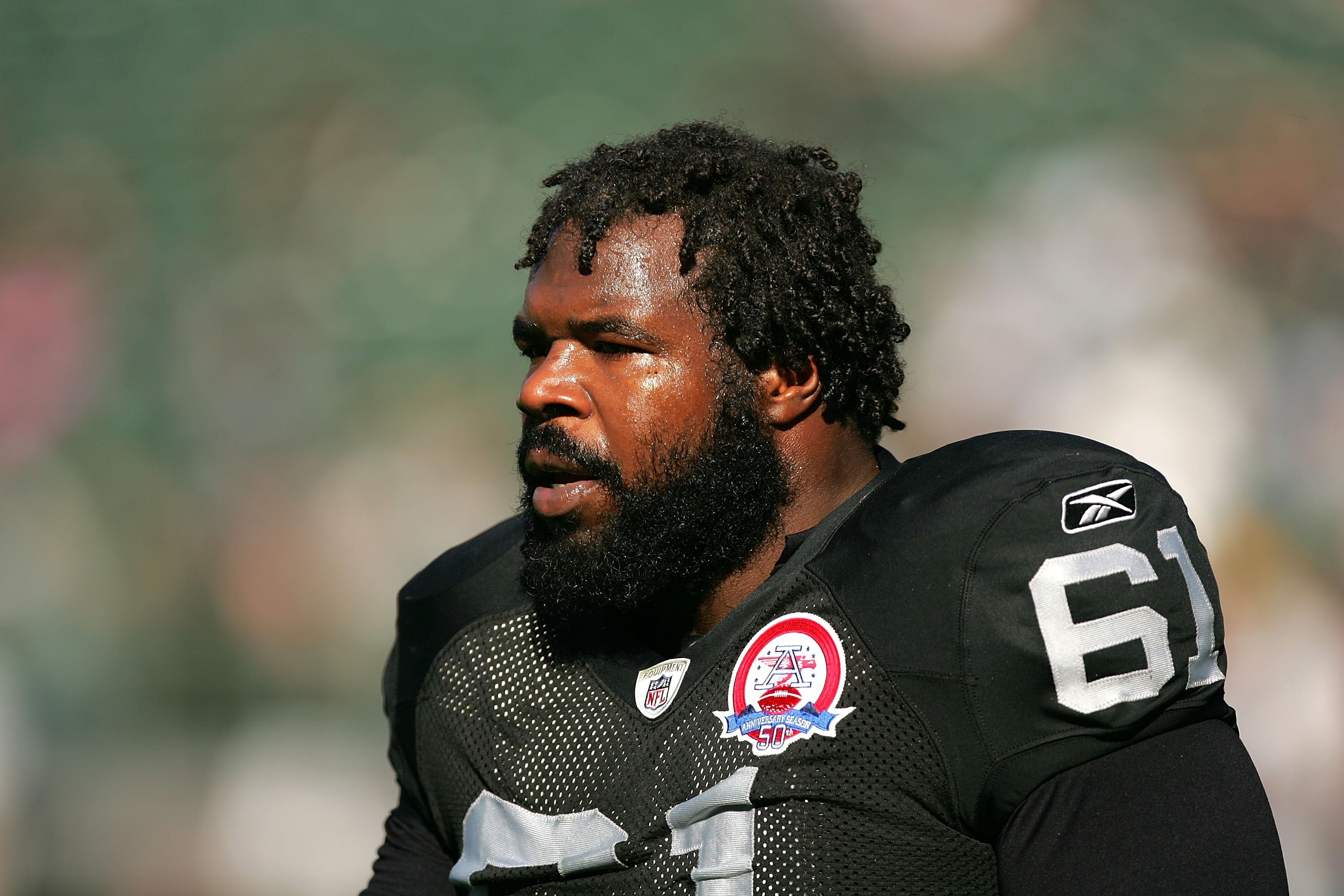 OAKLAND, CA - NOVEMBER 15:  Gerard Warren #61 of the Oakland Raiders warms up before their game against the Kansas City Chiefs at Oakland-Alameda County Coliseum on November 15, 2009 in Oakland, California.  (Photo by Ezra Shaw/Getty Images)