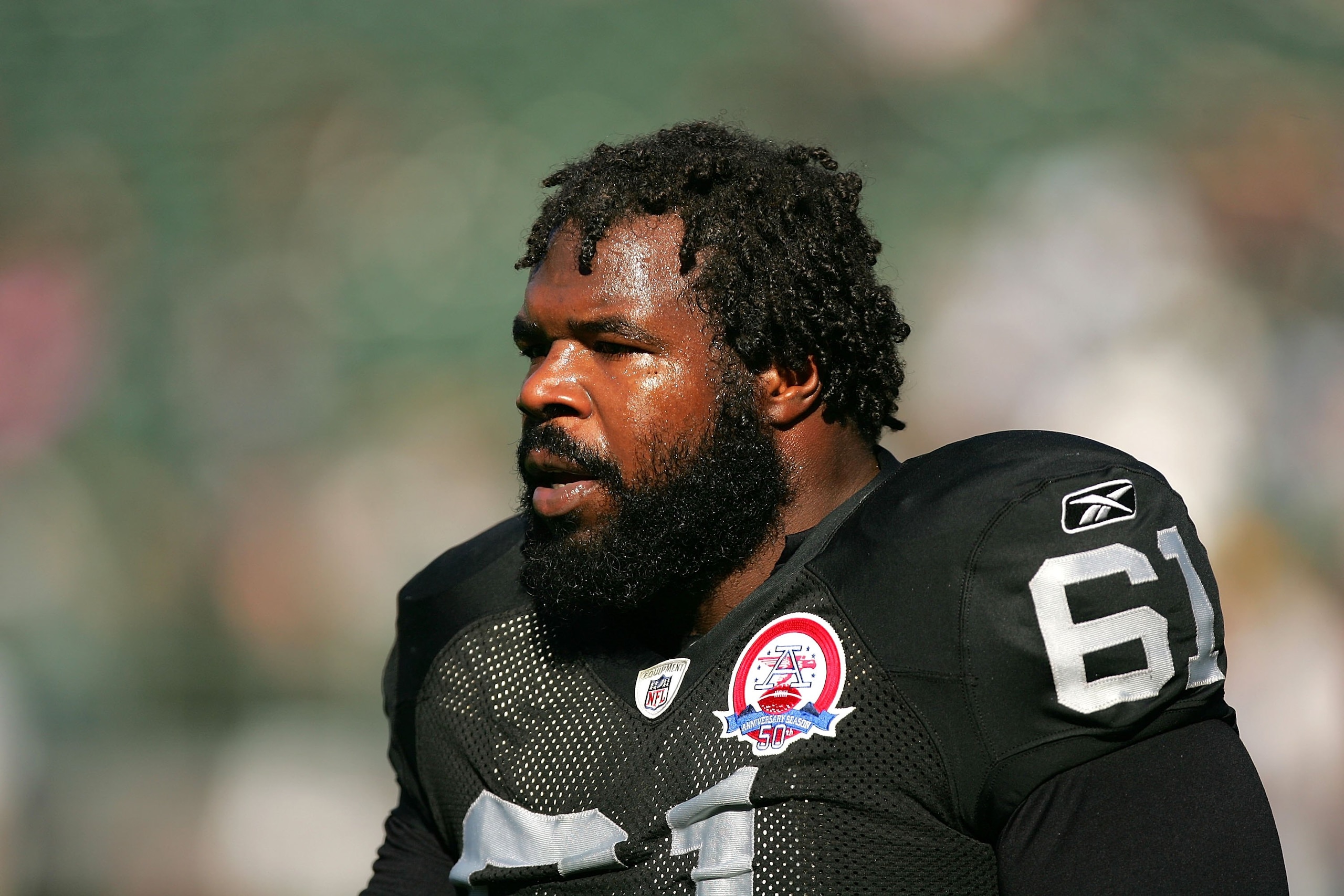OAKLAND, CA - NOVEMBER 15:  Gerard Warren #61 of the Oakland Raiders warms up before their game against the Kansas City Chiefs at Oakland-Alameda County Coliseum on November 15, 2009 in Oakland, California.  (Photo by Ezra Shaw/Getty Images)