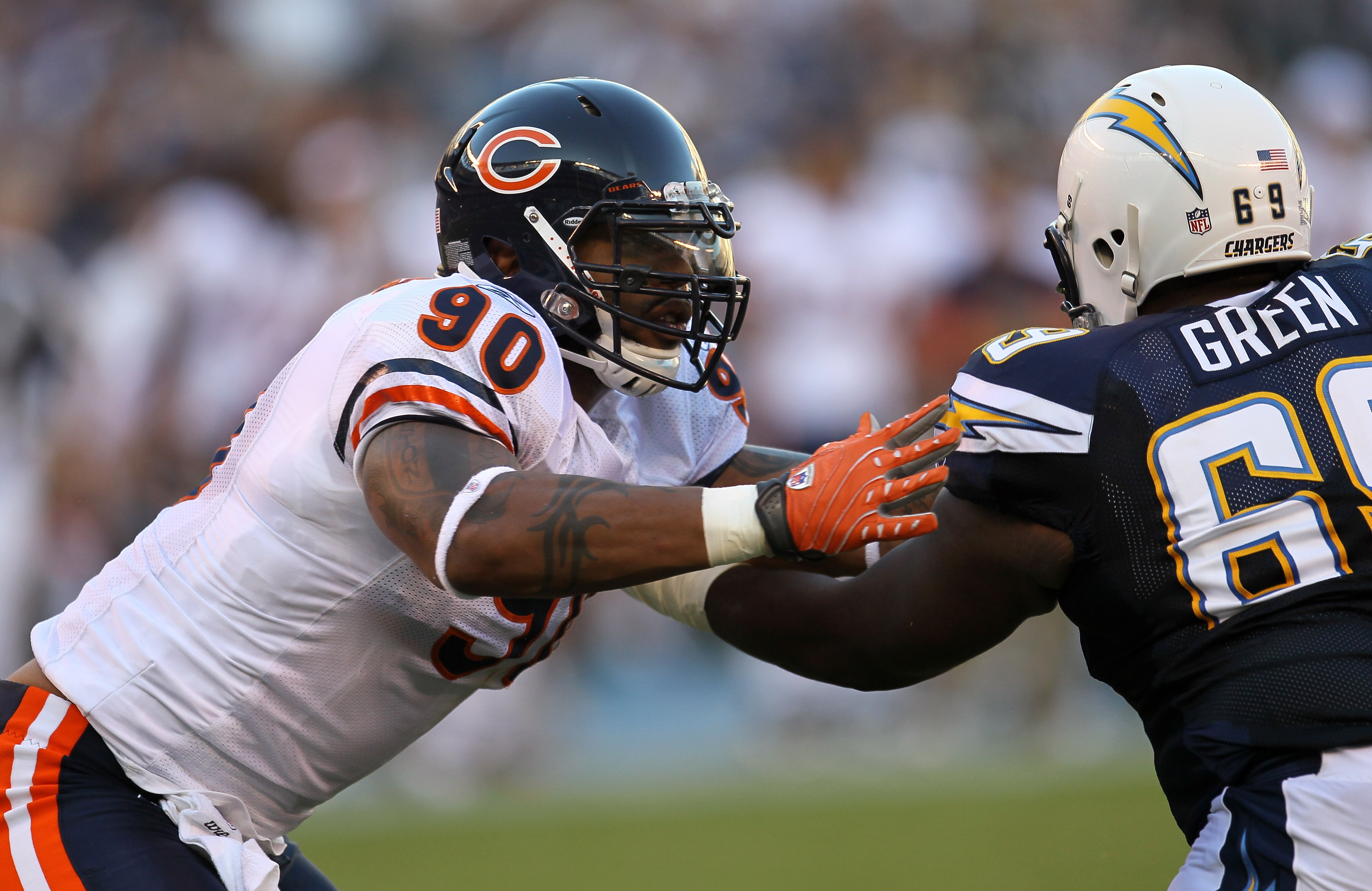SAN DIEGO - AUGUST 14:  Defensive end Julius Peppers #90 of the Chicago Bears battles offensive guard Tyrondne Green #69 of the San Diego Chargers on August 14, 2010 at Qualcomm Stadium in San Diego, California.   (Photo by Stephen Dunn/Getty Images)
