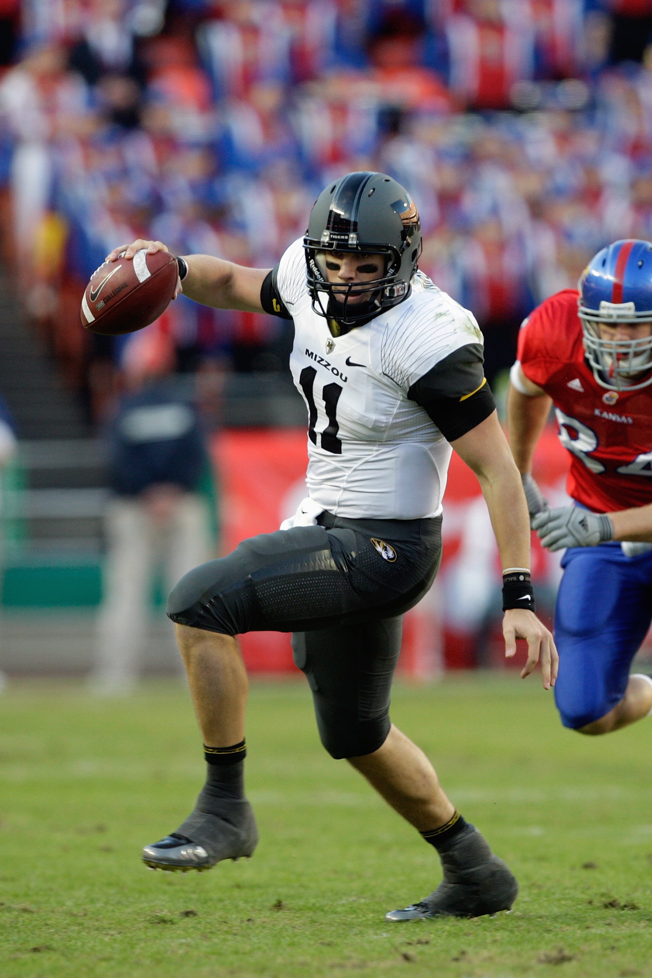 KANSAS CITY, MO - NOVEMBER 28:  Blaine Gabbert #11 of the Missouri Tigers scrambles during the game against the Kansas Jayhawks at Arrowhead Stadium on November 28, 2009 in Kansas City, Missouri. (Photo by Jamie Squire/Getty Images)