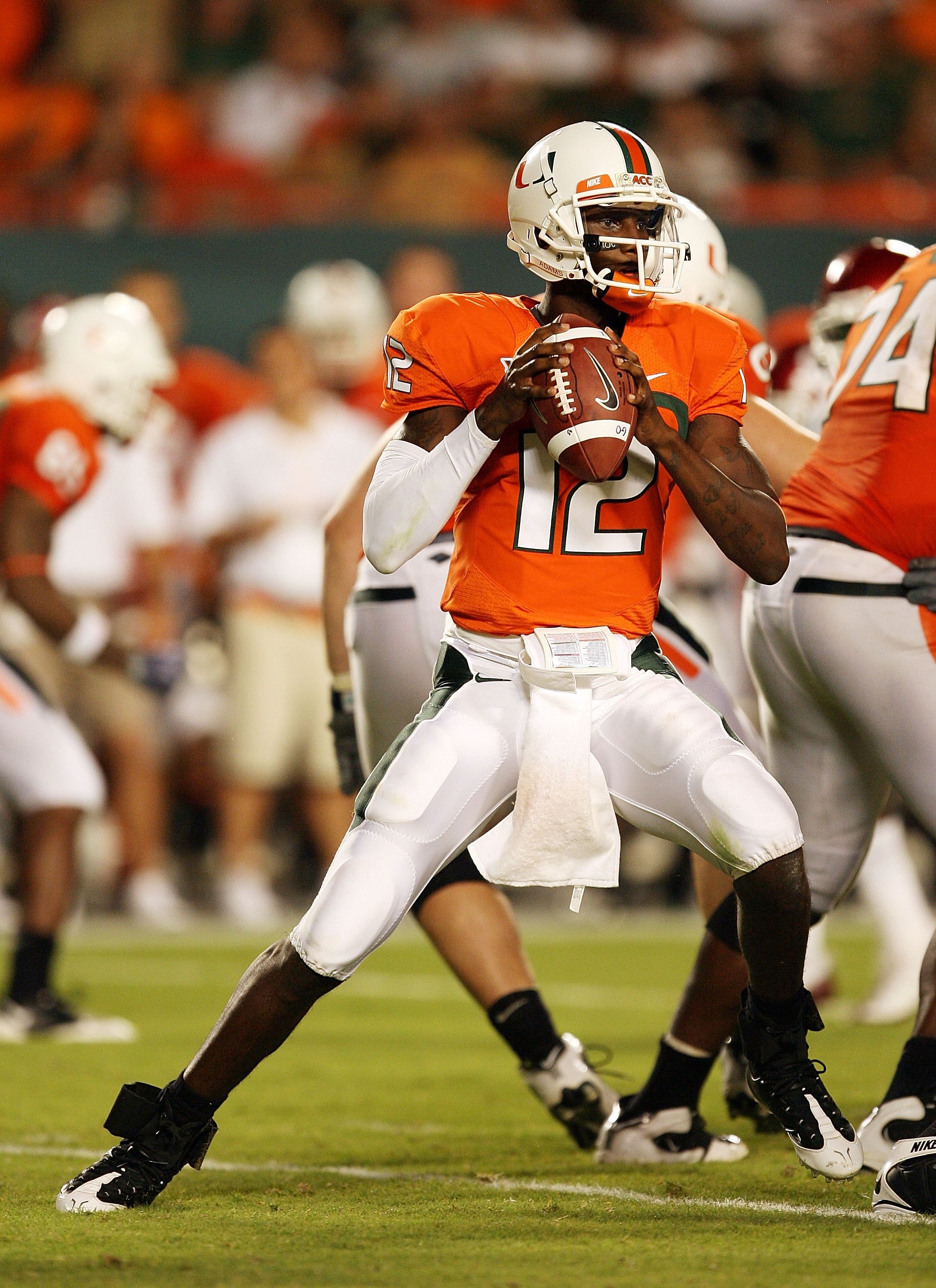 MIAMI GARDENS, FL - OCTOBER 03:  Quarterback Jacory Harris #12 of the Miami Hurricanes drops back to pass against the Oklahoma Sooners at Land Shark Stadium on October 3, 2009 in Miami Gardens, Florida. Miami defeated Oklahoma 21-20.  (Photo by Doug Benc/