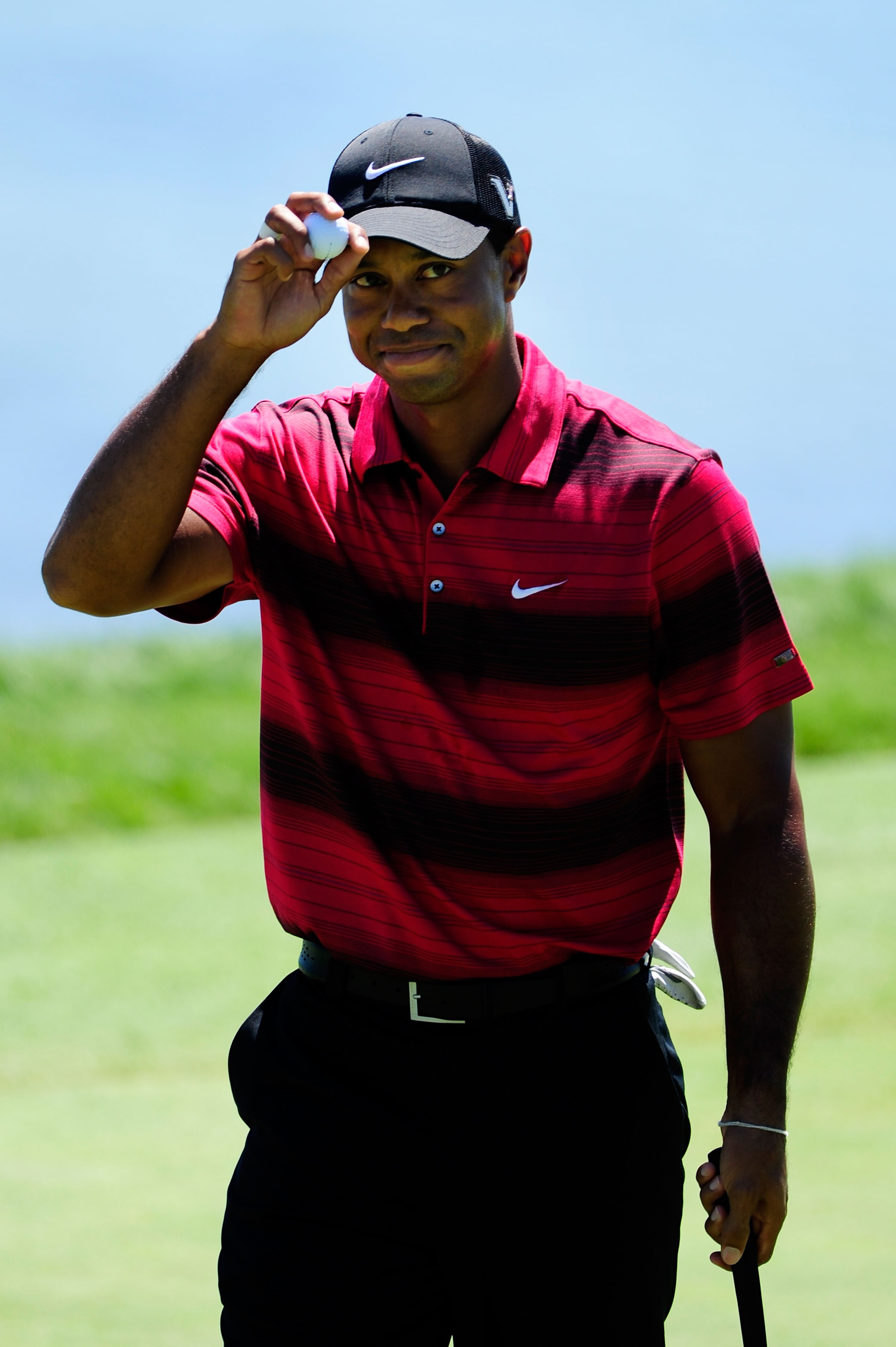 KOHLER, WI - AUGUST 15:  Tiger Woods waves to the gallery after a birdie putt on the seventh green during the final round of the 92nd PGA Championship on the Straits Course at Whistling Straits on August 15, 2010 in Kohler, Wisconsin.  (Photo by Stuart Fr