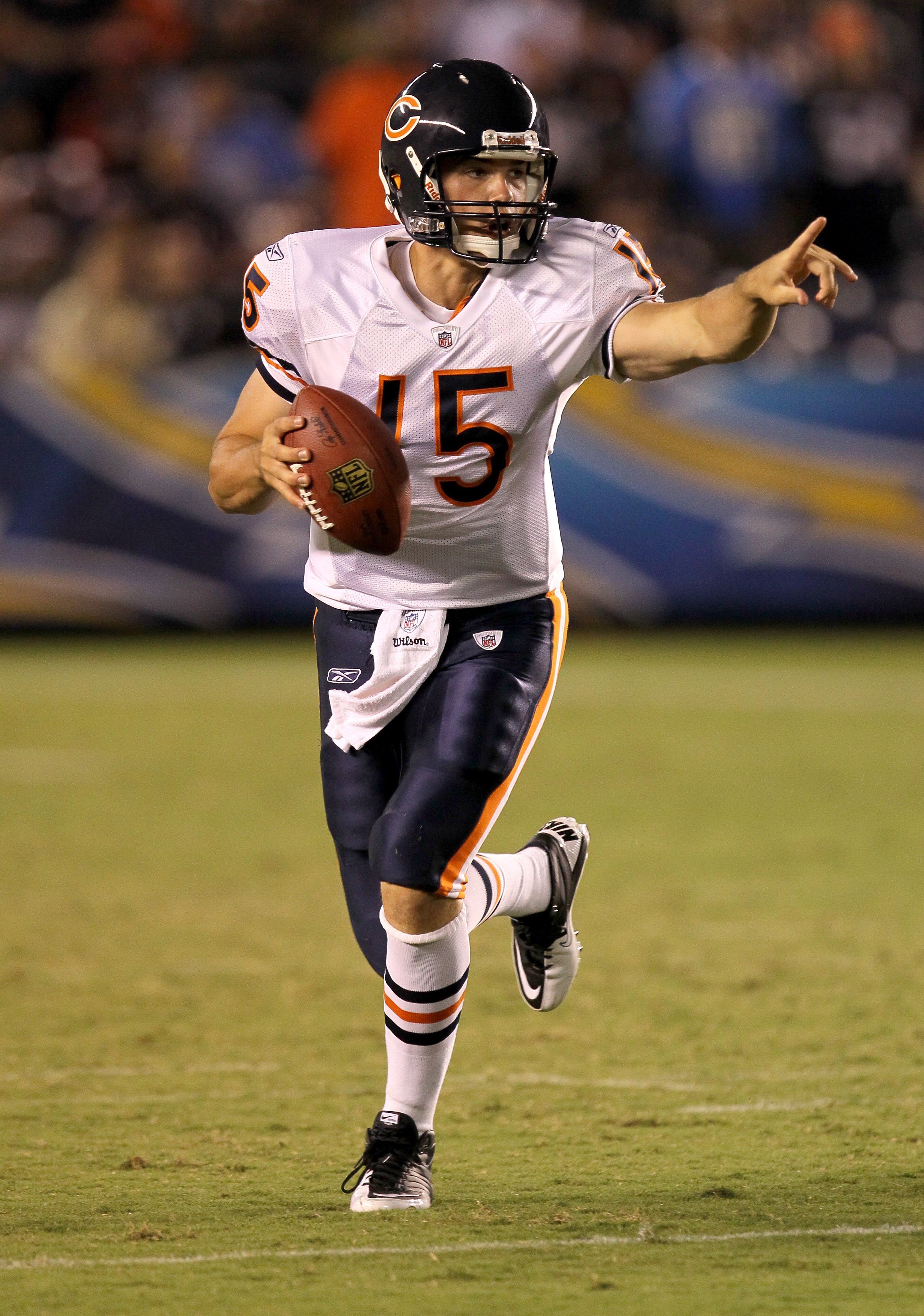 SAN DIEGO - AUGUST 14:  Quarterback Dan LeFevour  #15 of the Chicago Bears points as he scrambles with the ball against the San Diego Chargers on August 14, 2010 at Qualcomm Stadium in San Diego, California.   The Chargers won 25-10.   (Photo by Stephen D