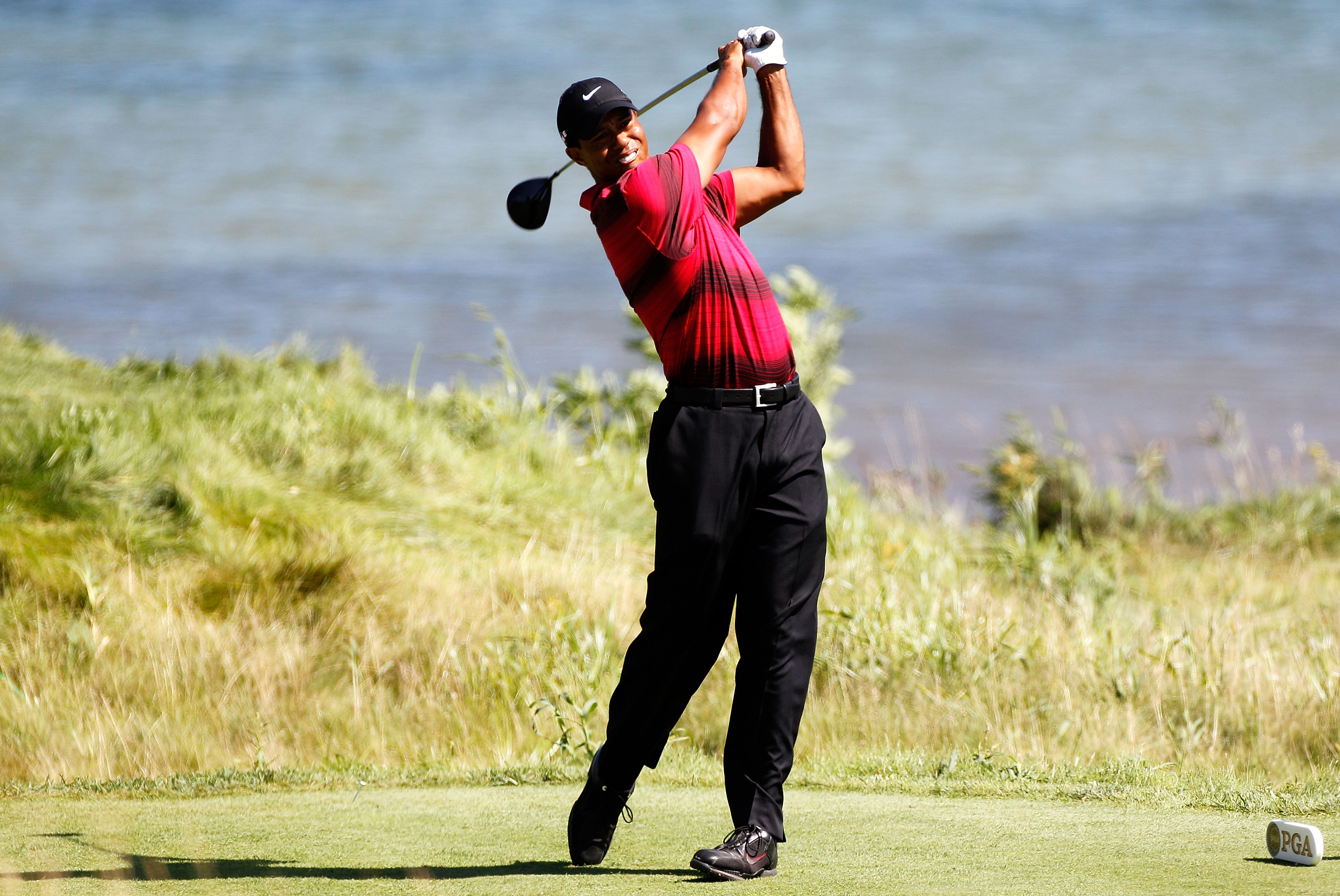 KOHLER, WI - AUGUST 15:  Tiger Woods watches his tee shot on the 18th hole during the final round of the 92nd PGA Championship on the Straits Course at Whistling Straits on August 15, 2010 in Kohler, Wisconsin.  (Photo by Sam Greenwood/Getty Images)