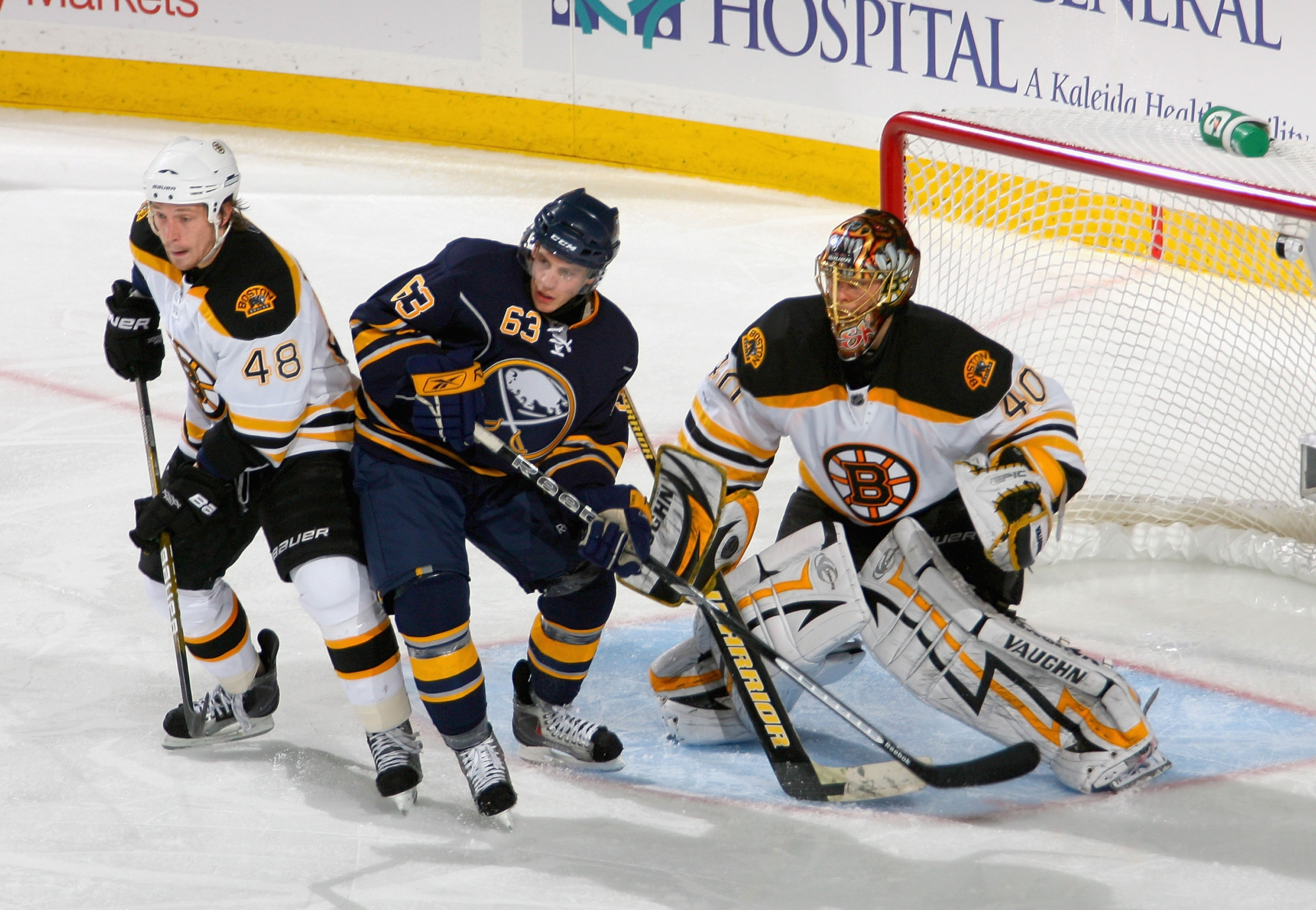 BUFFALO, NY - APRIL 23: Matt Hunwick #48 and Tuuka Rask #40  of the Boston Bruins defend against Tyler Ennis #63 of the Buffalo Sabres  in Game Five of the Eastern Conference Quarterfinals during the 2010 NHL Stanley Cup Playoffs at HSBC Arena on April 23