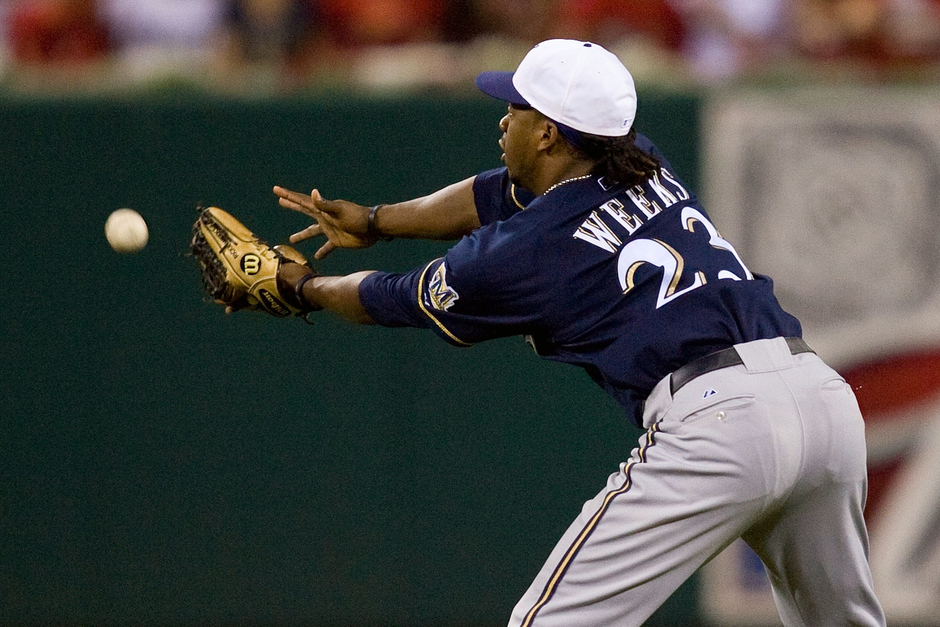 ST. LOUIS - JULY 2: Rickie Weeks #23 of the Milwaukee Brewers mis-plays a pop up against the St. Louis Cardinals at Busch Stadium on July 2, 2010 in St. Louis, Missouri.  The Cardinals beat the Brewers 5-0.  (Photo by Dilip Vishwanat/Getty Images)