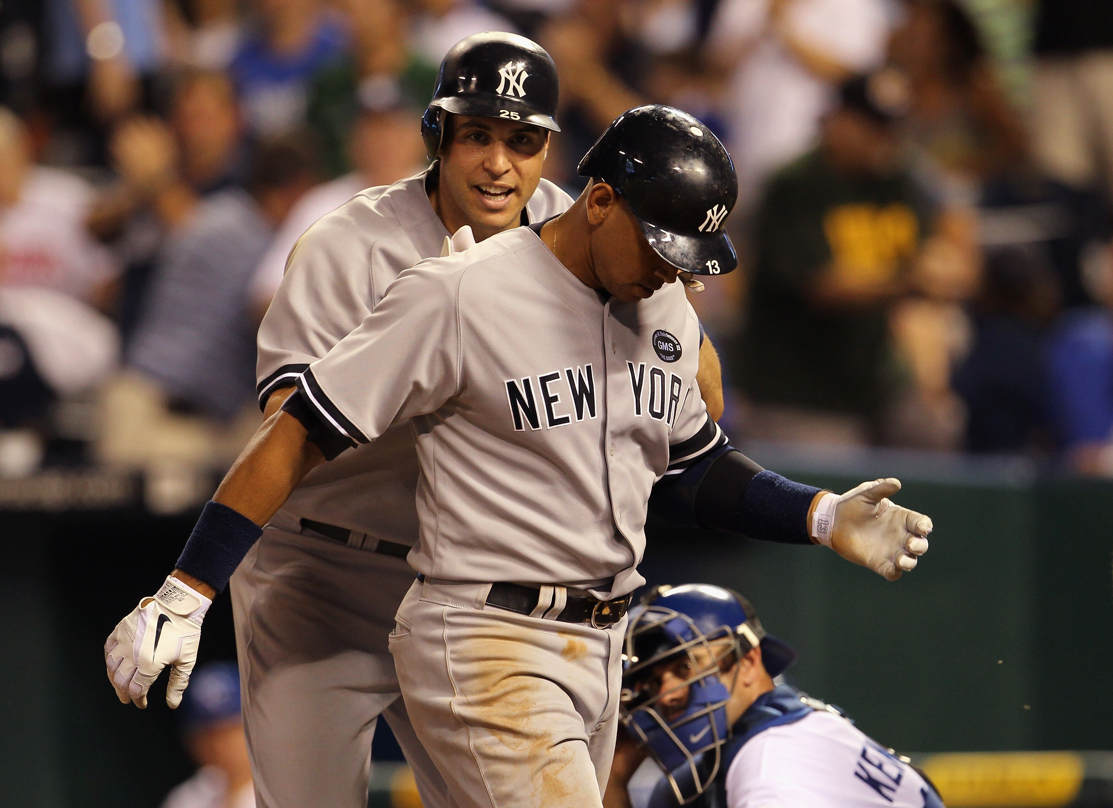 KANSAS CITY, MO - AUGUST 14:  Alex Rodriguez #13 of the New York Yankees is congratulated by Mark Teixeira #25 after hitting his 3rd home run of the night during the 8th inning of the game against the Kansas City Royals on August 14, 2010 at Kauffman Stad