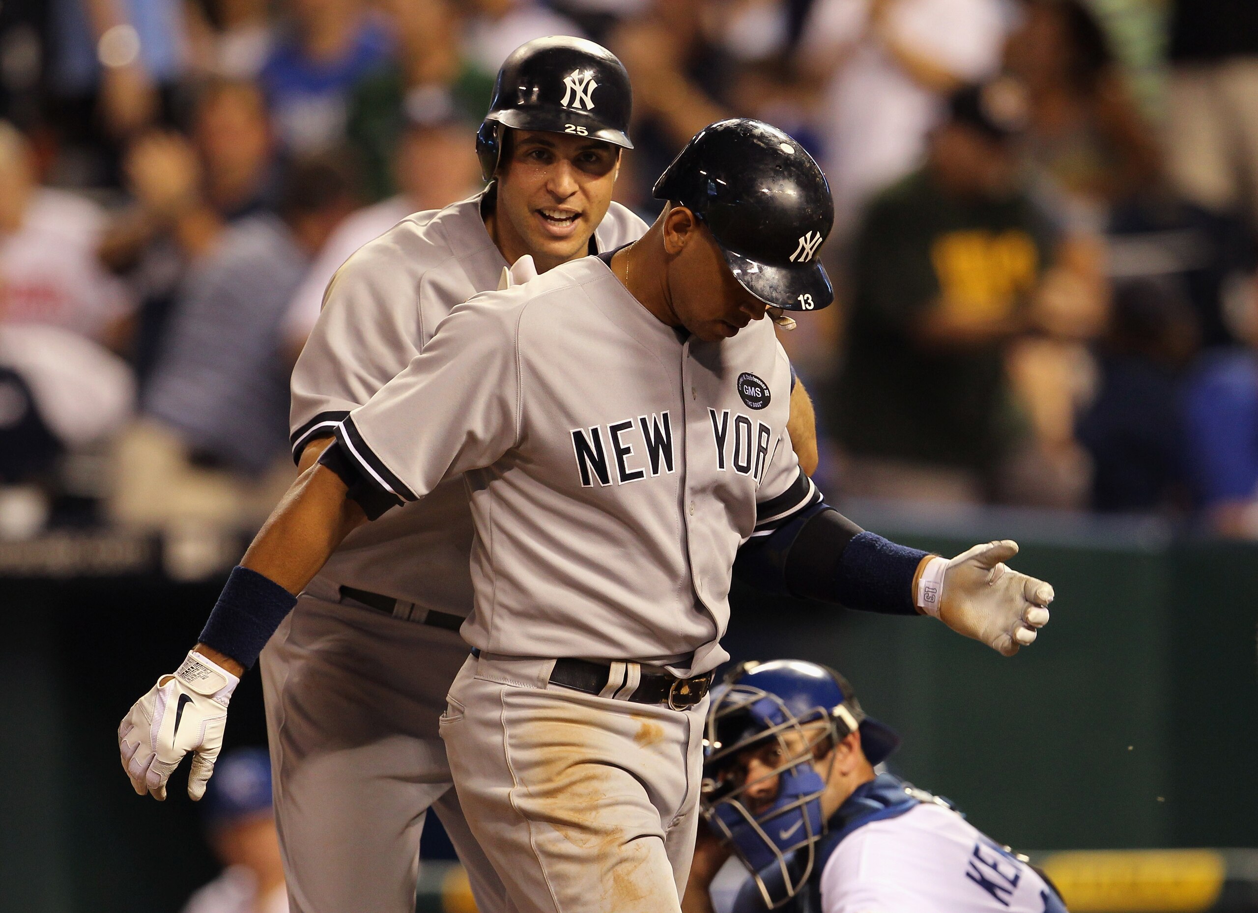 KANSAS CITY, MO - AUGUST 14:  Alex Rodriguez #13 of the New York Yankees is congratulated by Mark Teixeira #25 after hitting his 3rd home run of the night during the 8th inning of the game against the Kansas City Royals on August 14, 2010 at Kauffman Stad