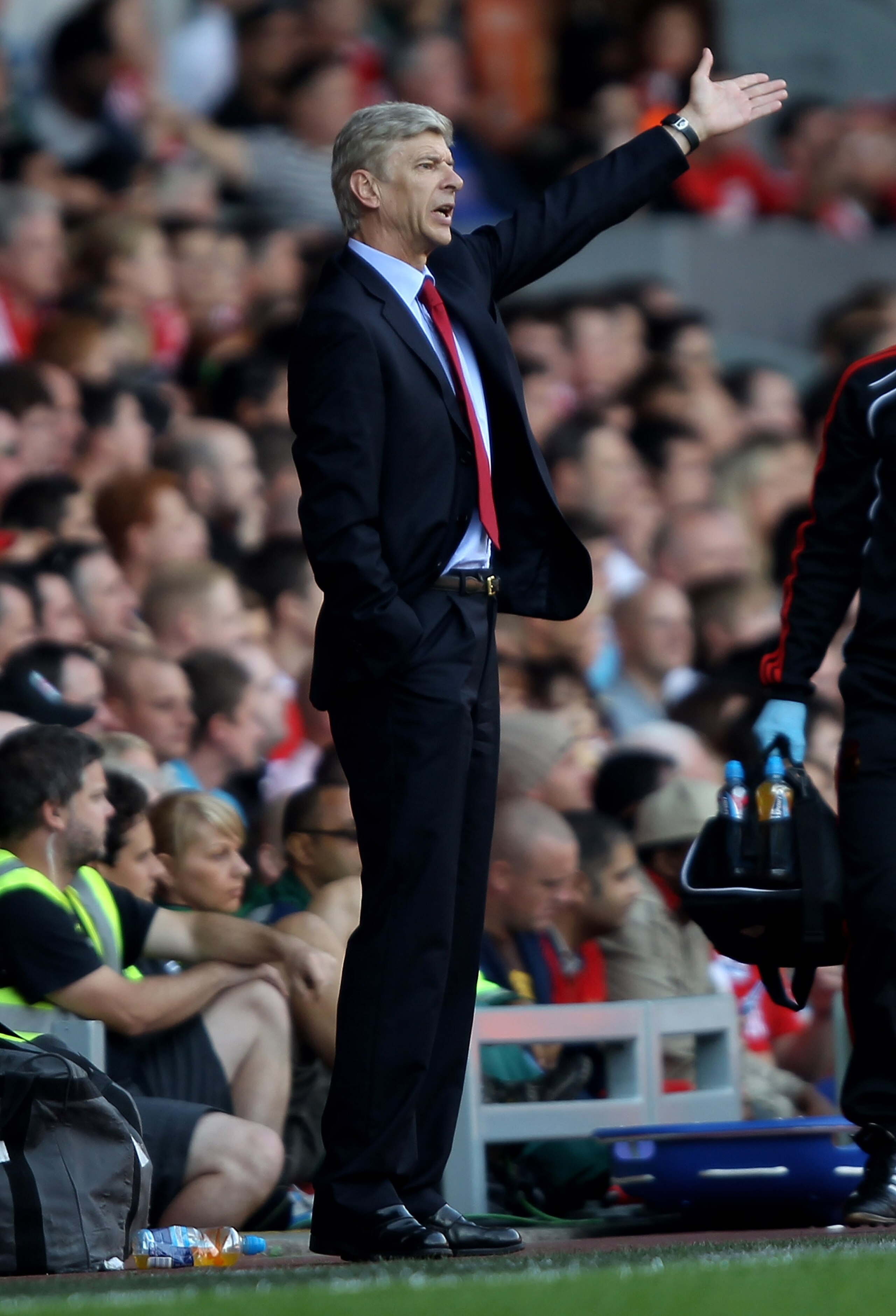 LIVERPOOL, ENGLAND - AUGUST 15: Arsenal Manager Arsene Wenger gestures during the Barclays Premier League match between Liverpool and Arsenal at Anfield on August 15, 2010 in Liverpool, England. (Photo by Clive Brunskill/Getty Images) LIVERPOOL, ENGLAND - AUGUST 15: Arsenal Manager Arsene Wenger gestures during the Barclays Premier League match between Liverpool and Arsenal at Anfield on August 15, 2010 in Liverpool, England. (Photo by Clive Brunskill/Getty Images)