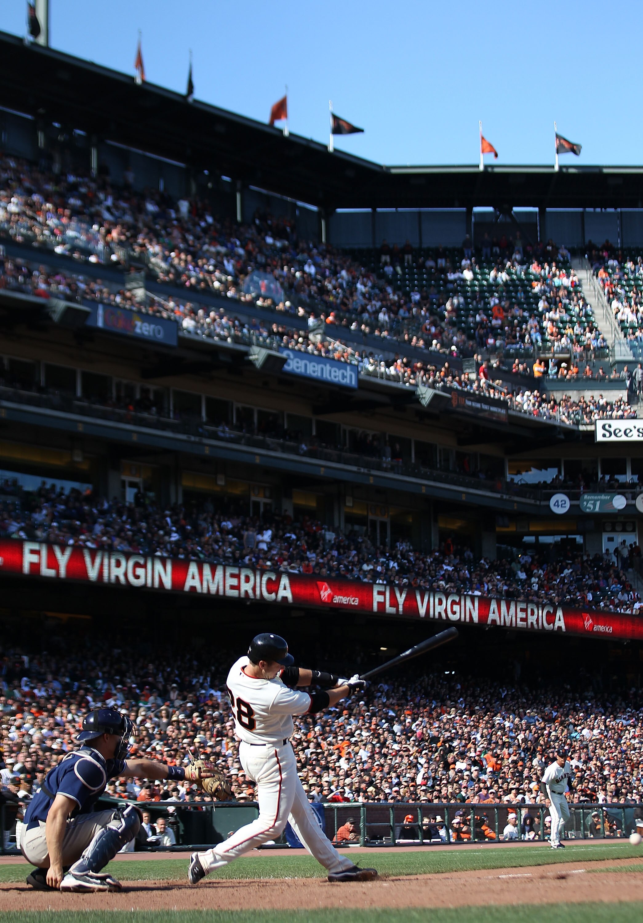 SAN FRANCISCO - AUGUST 14:  Buster Posey #28 of the San Francisco Giants doubles in the eleventh inning against the San Diego Padres during an MLB game at AT&T Park on August 14, 2010 in San Francisco, California.  (Photo by Jed Jacobsohn/Getty Images)