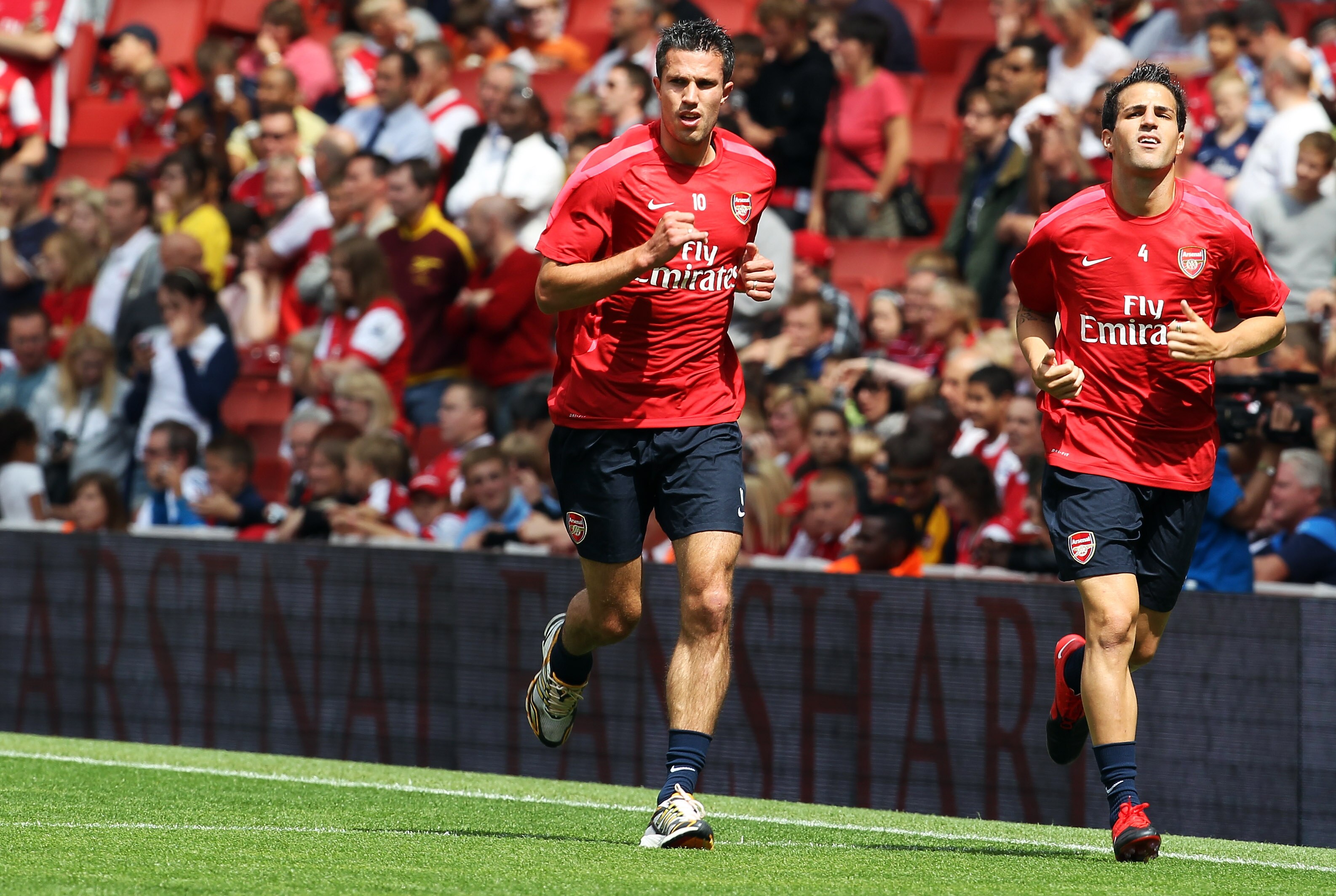 LONDON, ENGLAND - AUGUST 05:  Cesc Fabregas (r) and Robin van Persie attend an Arsenal open training session at Emirates Stadium on August 5, 2010 in London, England.  (Photo by Bryn Lennon/Getty Images)