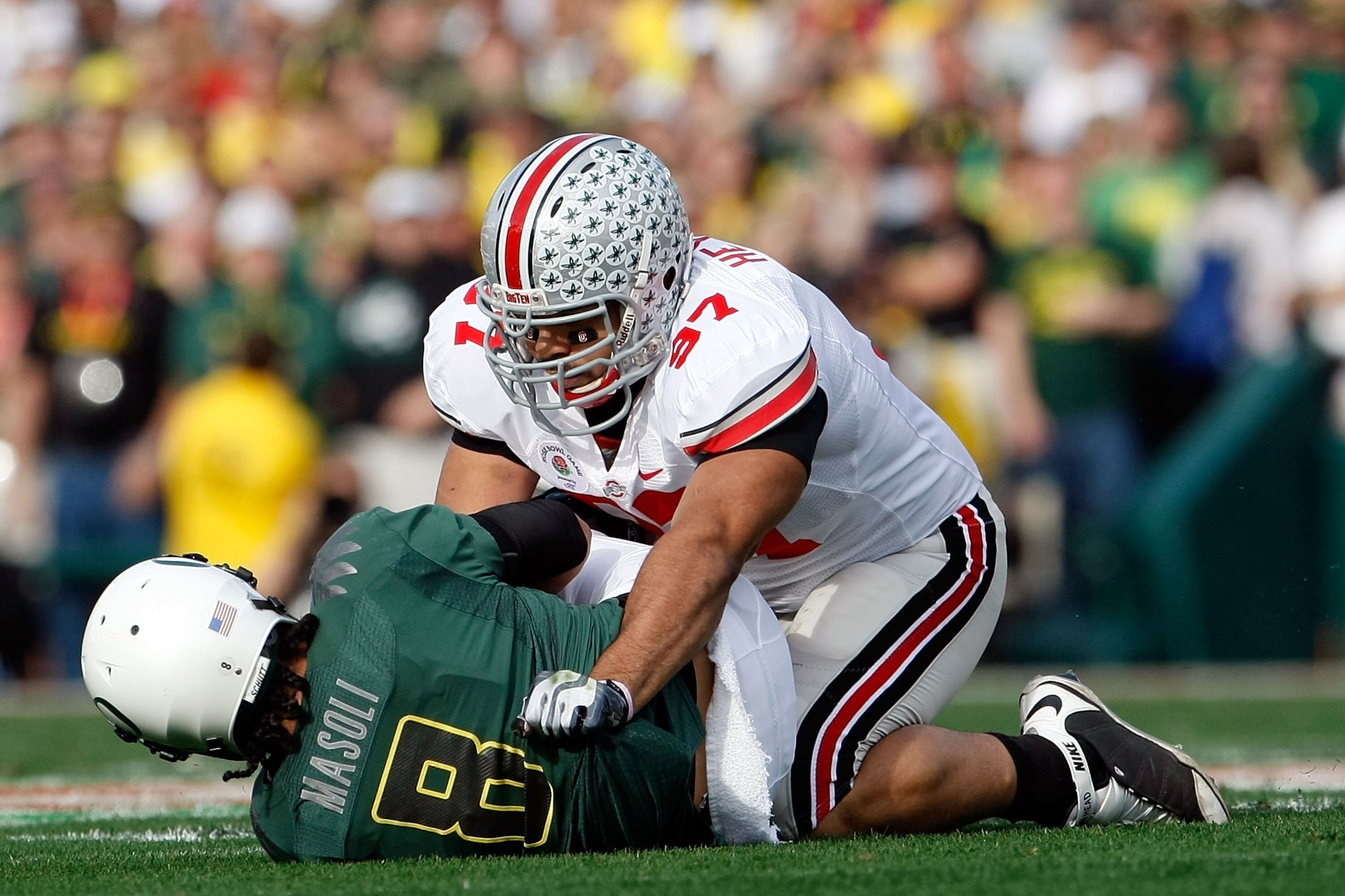PASADENA, CA - JANUARY 01:  Defensive lineman Cameron Heyward #97 of the Ohio State Buckeyes sacks quarterback Jeremiah Masoli #8 of the Oregon Ducks during the 96th Rose Bowl game on January 1, 2010 in Pasadena, California.  (Photo by Jeff Gross/Getty Im