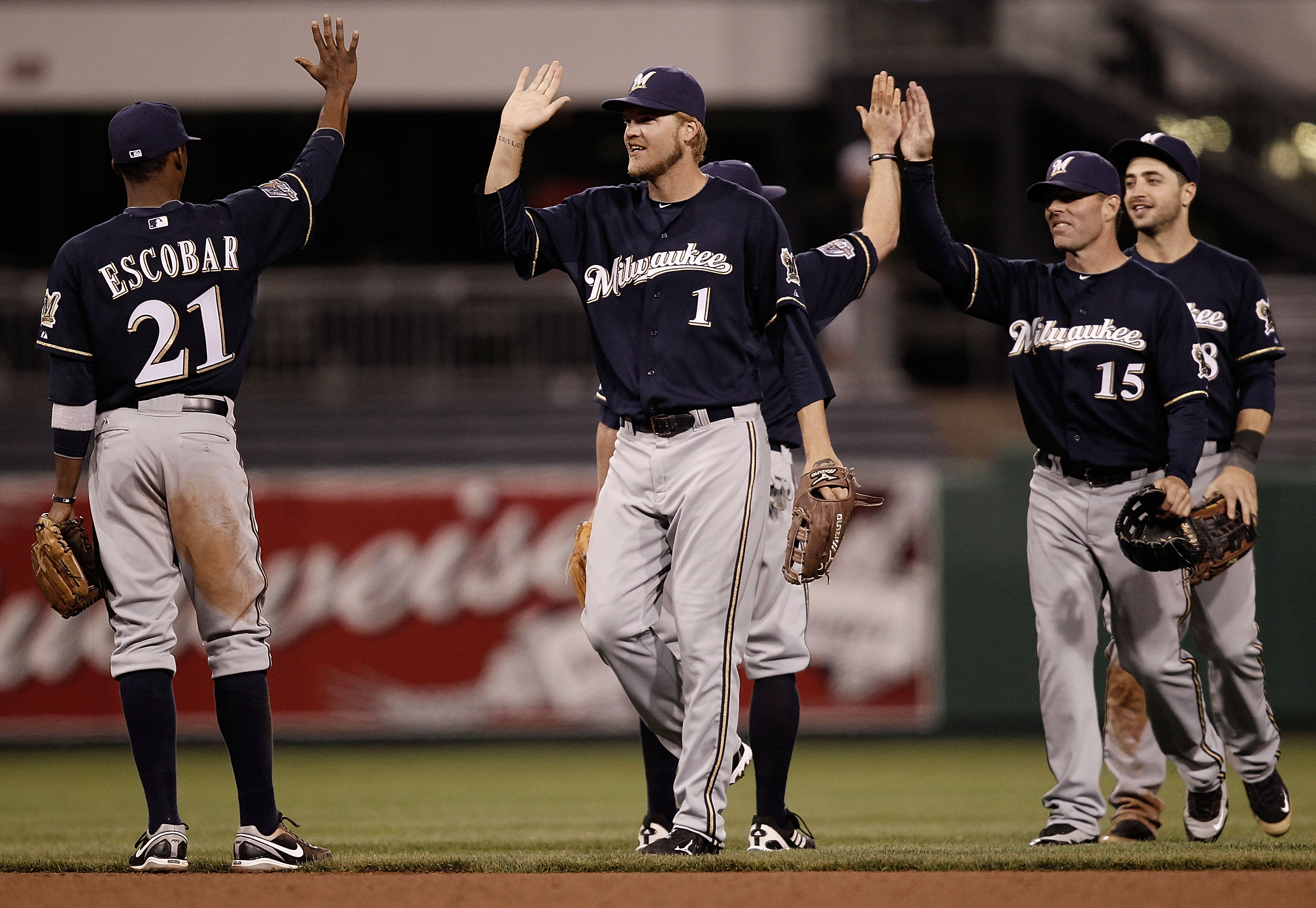 PITTSBURGH - APRIL 20: Alcides Escobar #21, Corey Hart #1, Jim Edmonds #15, and Ryan Braun #8 of the Milwaukee Brewers congratulate each other after beating of the Pittsburgh Pirates 8-1 on April 20, 2010 at PNC Park in Pittsburgh, Pennsylvania.  (Photo b