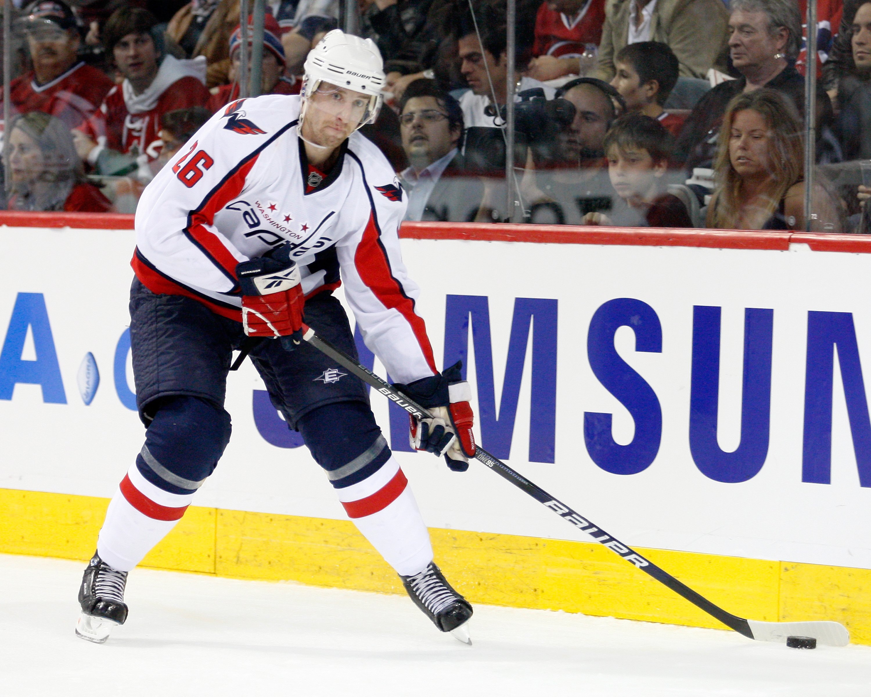 MONTREAL- APRIL 19:  Shaone Morrisonn #26 of the Washington Capitals skates with the puck in Game Three of the Eastern Conference Quarterfinals against the Montreal Canadiens during the 2010 NHL Stanley Cup Playoffs at the Bell Centre on April 19, 2010 in
