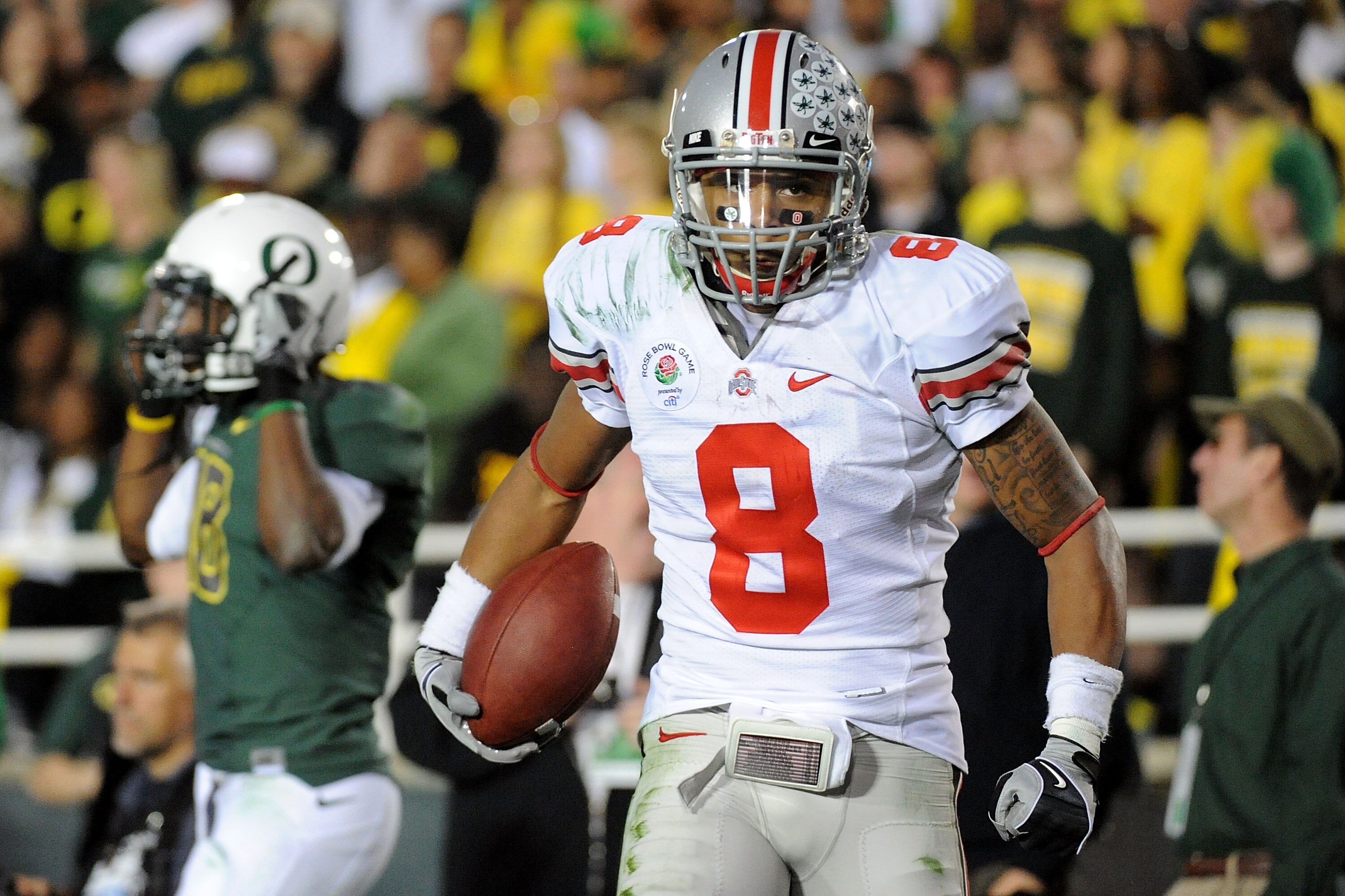 PASADENA, CA - JANUARY 01:  Wide receiver DeVier Posey #8 of the Ohio State Buckeyes celebrates after scoring a touchdown in the fourth quarter of the 96th Rose Bowl game against the Oregon Ducks on January 1, 2010 in Pasadena, California.  (Photo by Harr