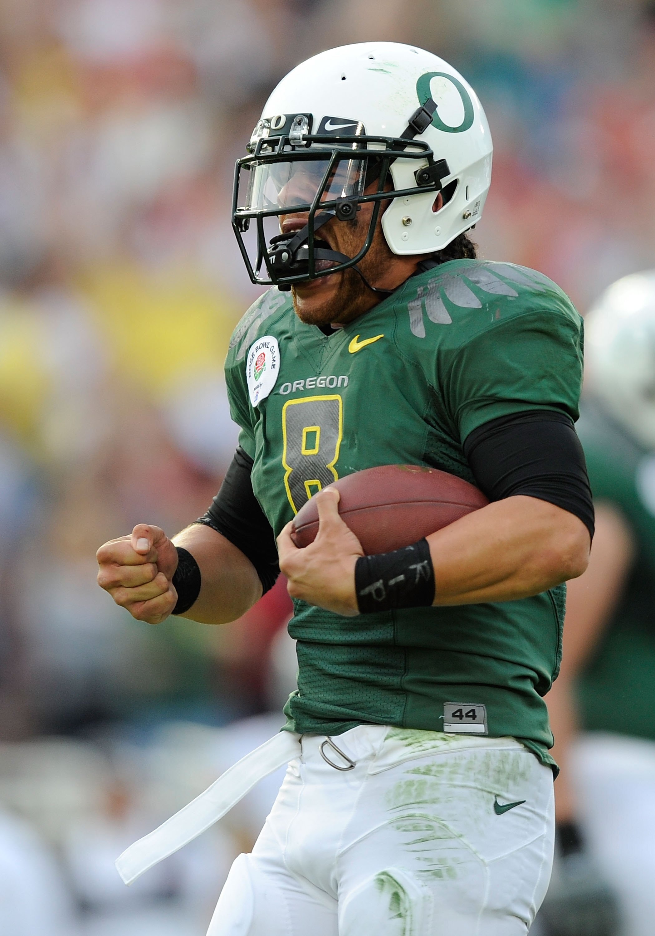 PASADENA, CA - JANUARY 01:  Quarterback Jeremiah Masoli #8 of the Oregon Ducks celebrates after scoring a touchdown against the Ohio State Buckeyes in the 96th Rose Bowl game on January 1, 2010 in Pasadena, California.  (Photo by Kevork Djansezian/Getty I