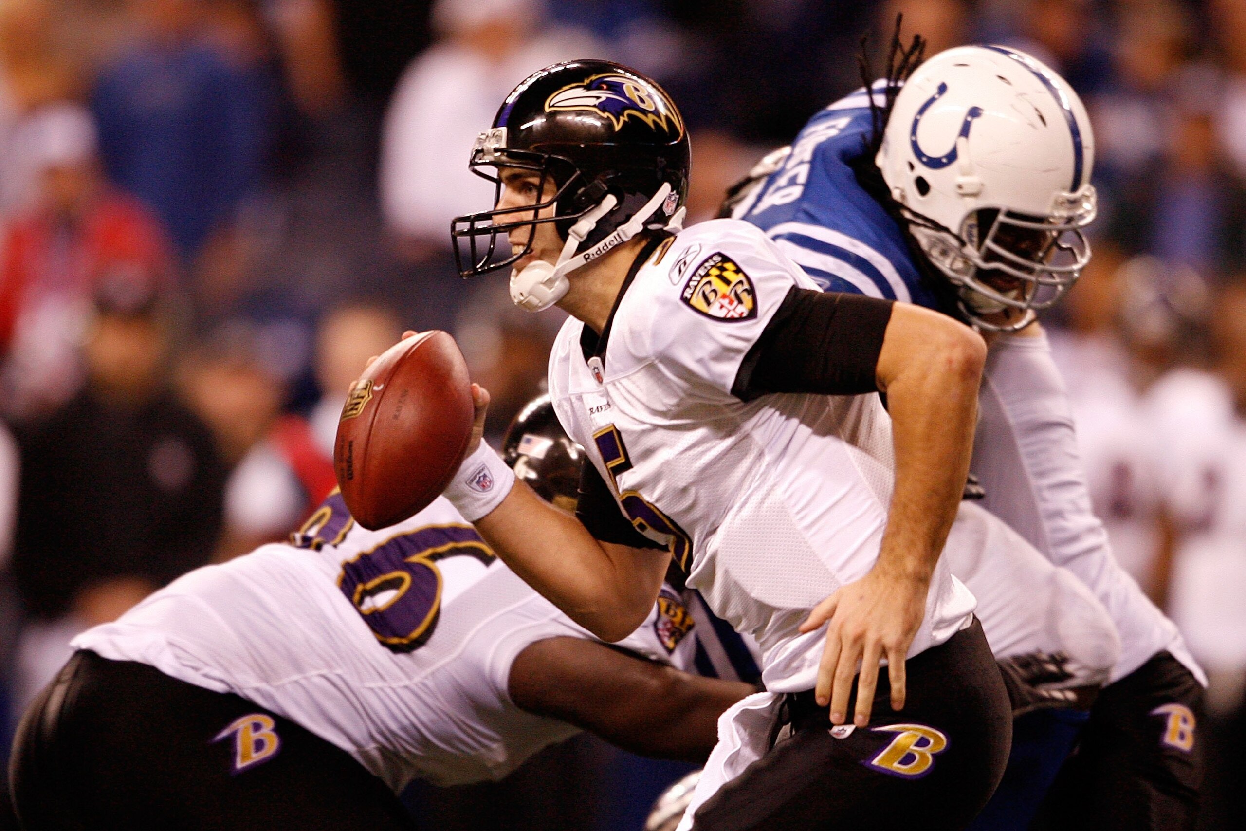 INDIANAPOLIS - JANUARY 16:  Quarterback Joe Flacco #5 of the Baltimore Ravens runs with the ball against the Indianapolis Colts in the AFC Divisional Playoff Game at Lucas Oli Stadium on January 16, 2010 in Indianapolis, Indiana.  (Photo by Andy Lyons/Get