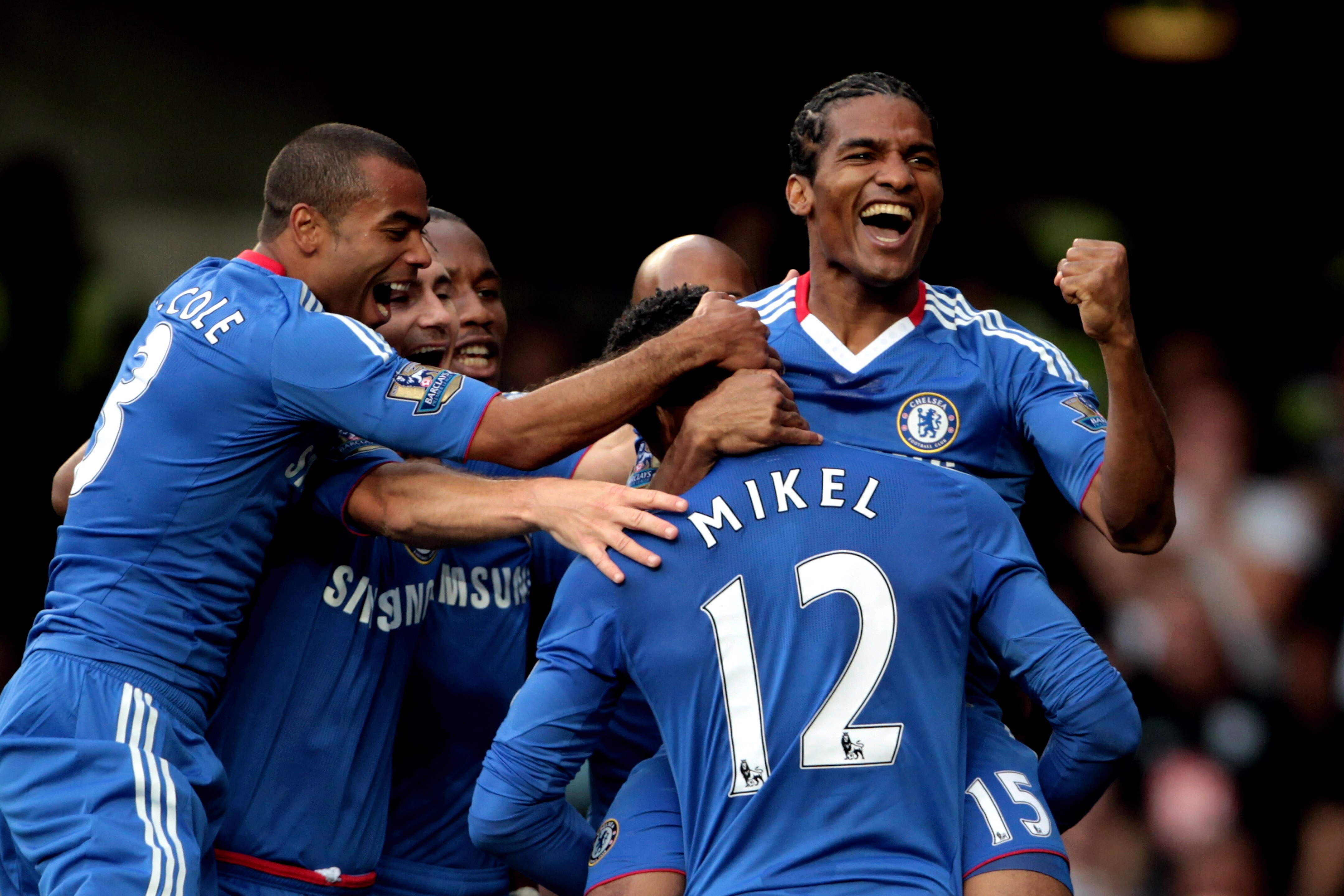LONDON, ENGLAND - AUGUST 14:  Florent Malouda #15 (R) of Chelsea is congratulated by teammates after scoring the opening goal during the Barclays Premier League match between Chelsea and West Bromwich Albion at Stamford Bridge on August 14, 2010 in London
