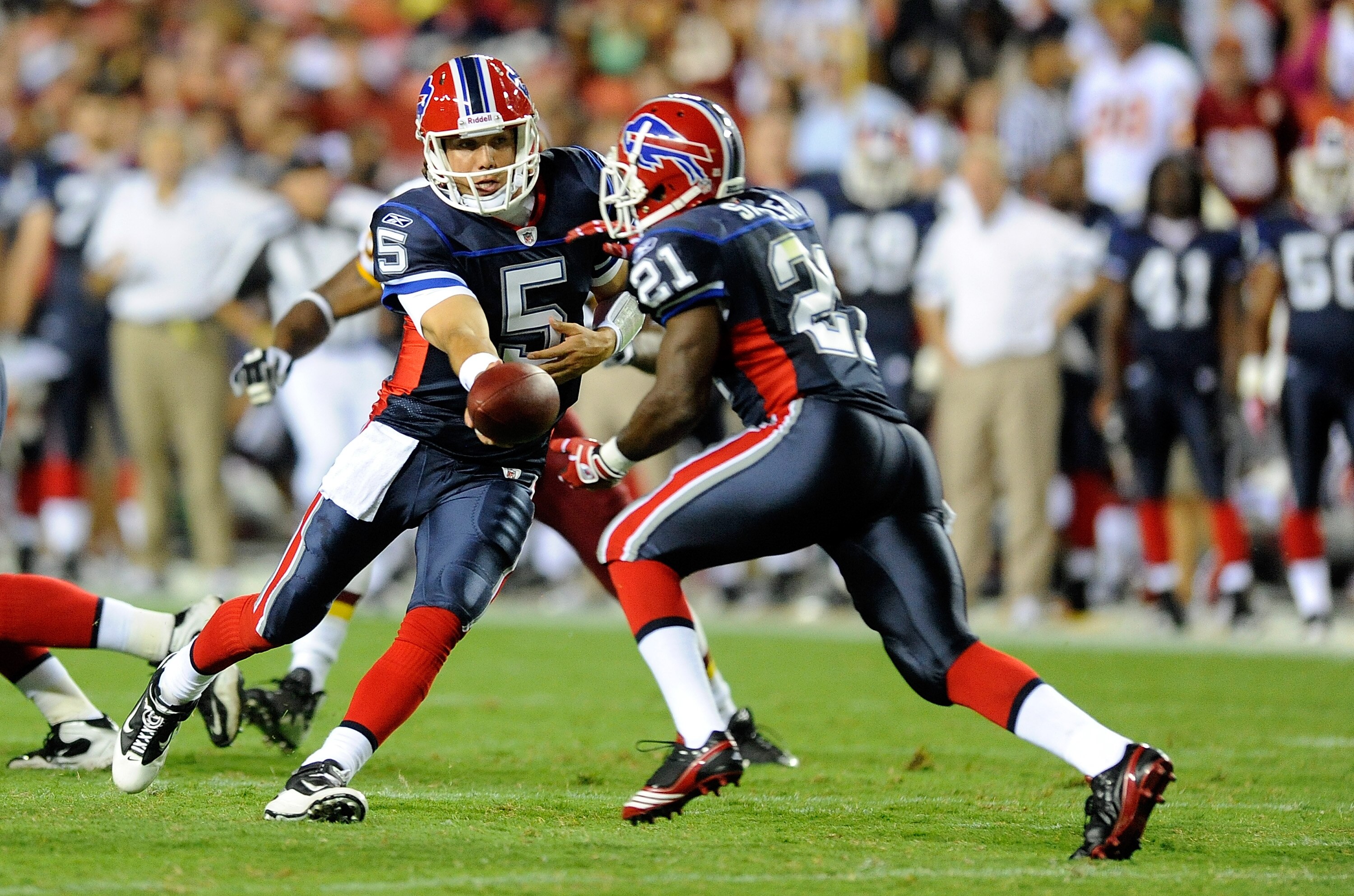LANDOVER, MD - AUGUST 13:  Trent Edwards #5 of the Buffalo Bills hands the ball off to C.J. Spiller #21 during the preseason game against the Washington Redskins at FedEx Field on August 13, 2010 in Landover, Maryland.  (Photo by Greg Fiume/Getty Images)