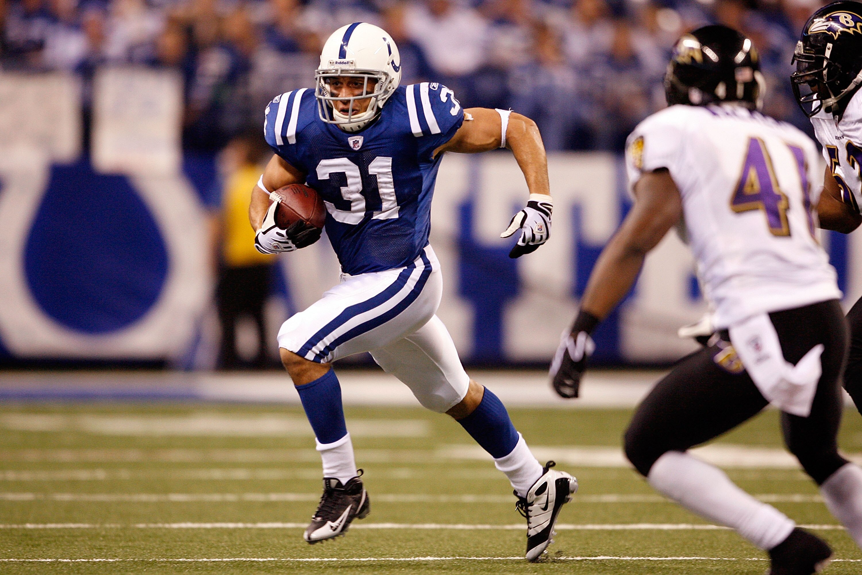 INDIANAPOLIS - JANUARY 16:  Donald Brown #31 of the Indianapolis Colts runs the ball in the first half against the Baltimore Ravens in the AFC Divisional Playoff Game at Lucas Oli Stadium on January 16, 2010 in Indianapolis, Indiana.  (Photo by Andy Lyons