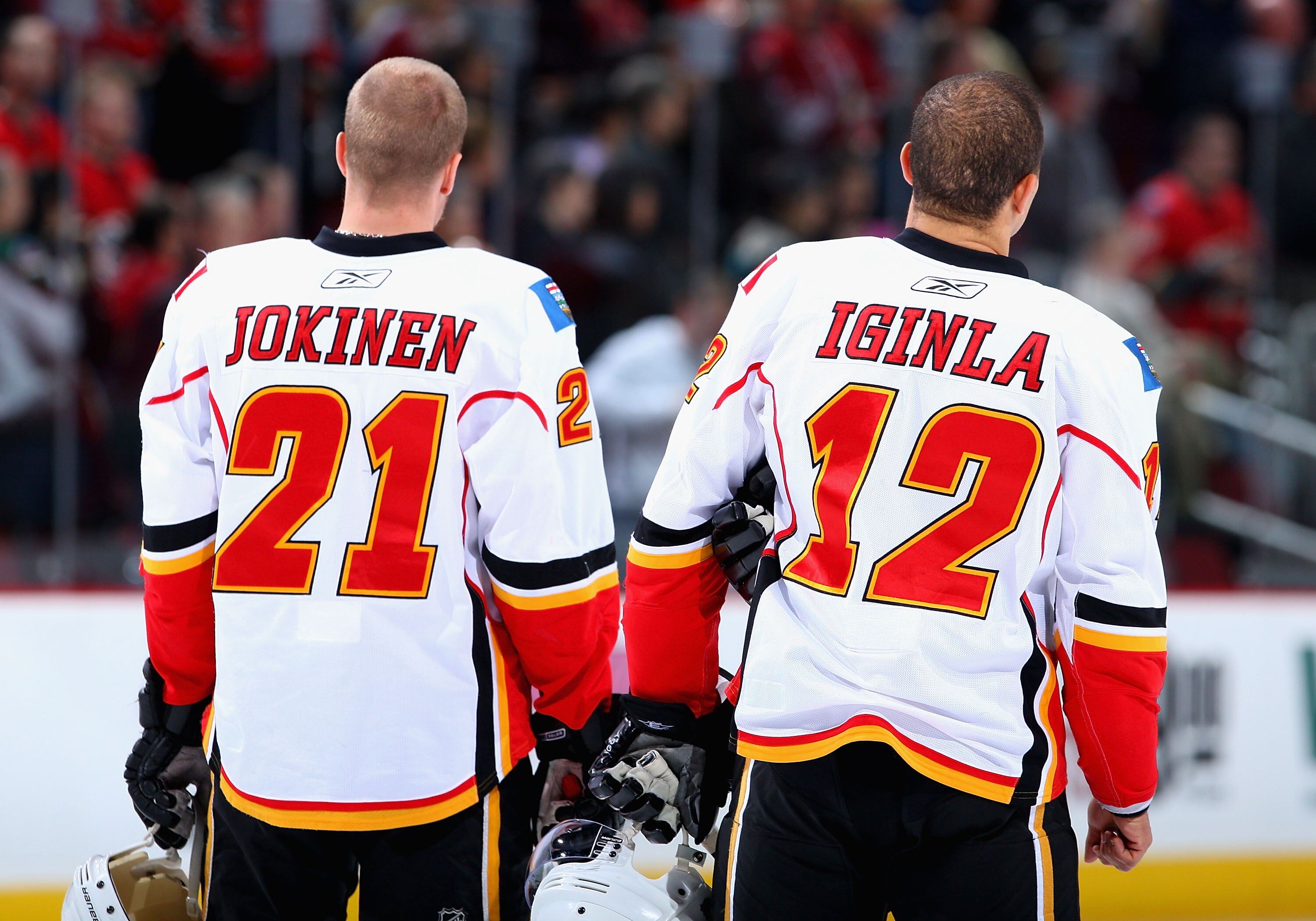GLENDALE, AZ - DECEMBER 03:  Olli Jokinen#21 and Jarome Iginla #12 of the Calgary Flames stand for the National Anthem before the NHL game against the Phoenix Coyotes at Jobing.com Arena on December 3, 2009 in Glendale, Arizona.  The Coyotes defeated the 