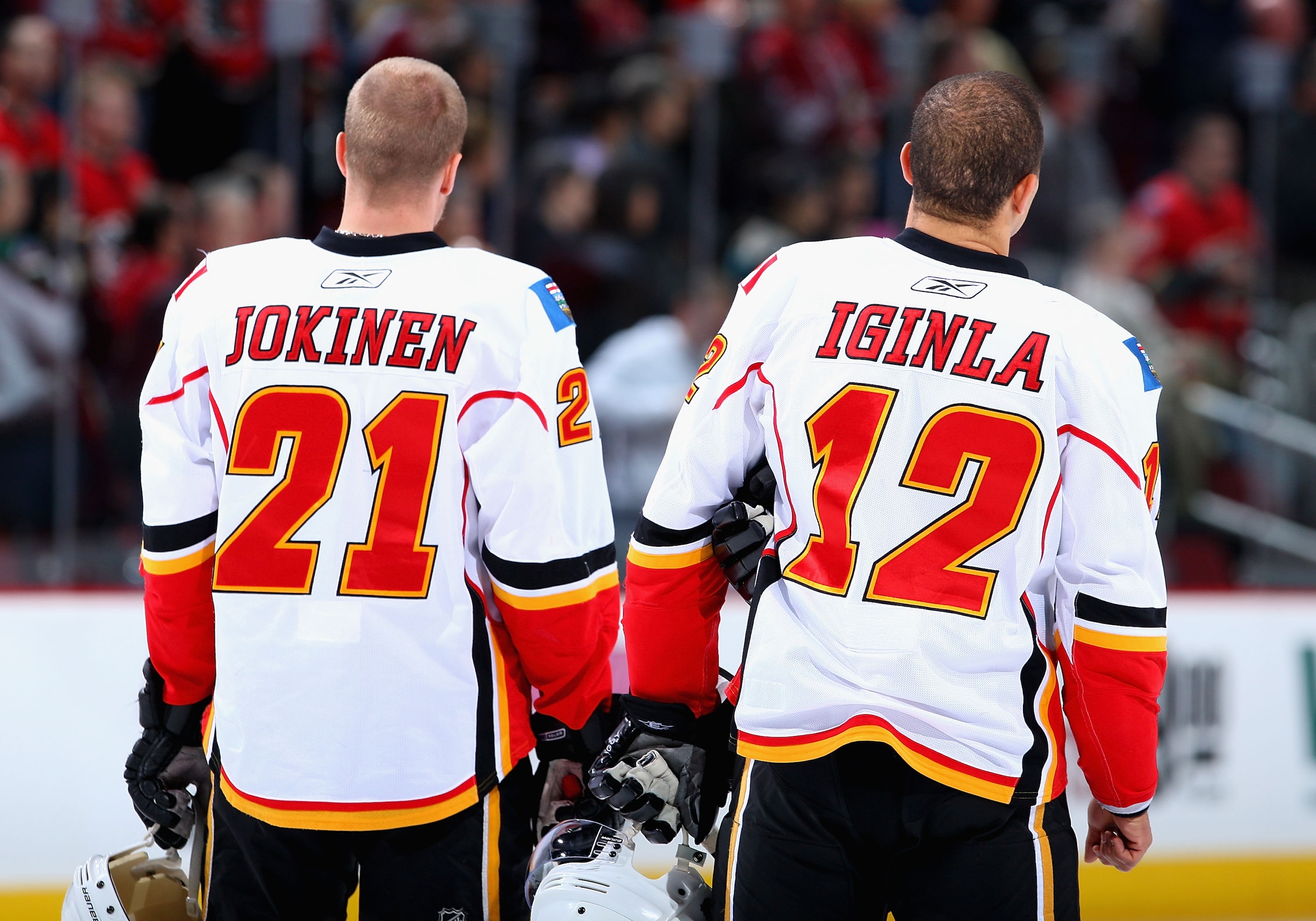 GLENDALE, AZ - DECEMBER 03: Olli Jokinen#21 and Jarome Iginla #12 of the Calgary Flames stand for the National Anthem before the NHL game against the Phoenix Coyotes at Jobing.com Arena on December 3, 2009 in Glendale, Arizona. The Coyotes defeated the GLENDALE, AZ - DECEMBER 03: Olli Jokinen#21 and Jarome Iginla #12 of the Calgary Flames stand for the National Anthem before the NHL game against the Phoenix Coyotes at Jobing.com Arena on December 3, 2009 in Glendale, Arizona. The Coyotes defeated the
