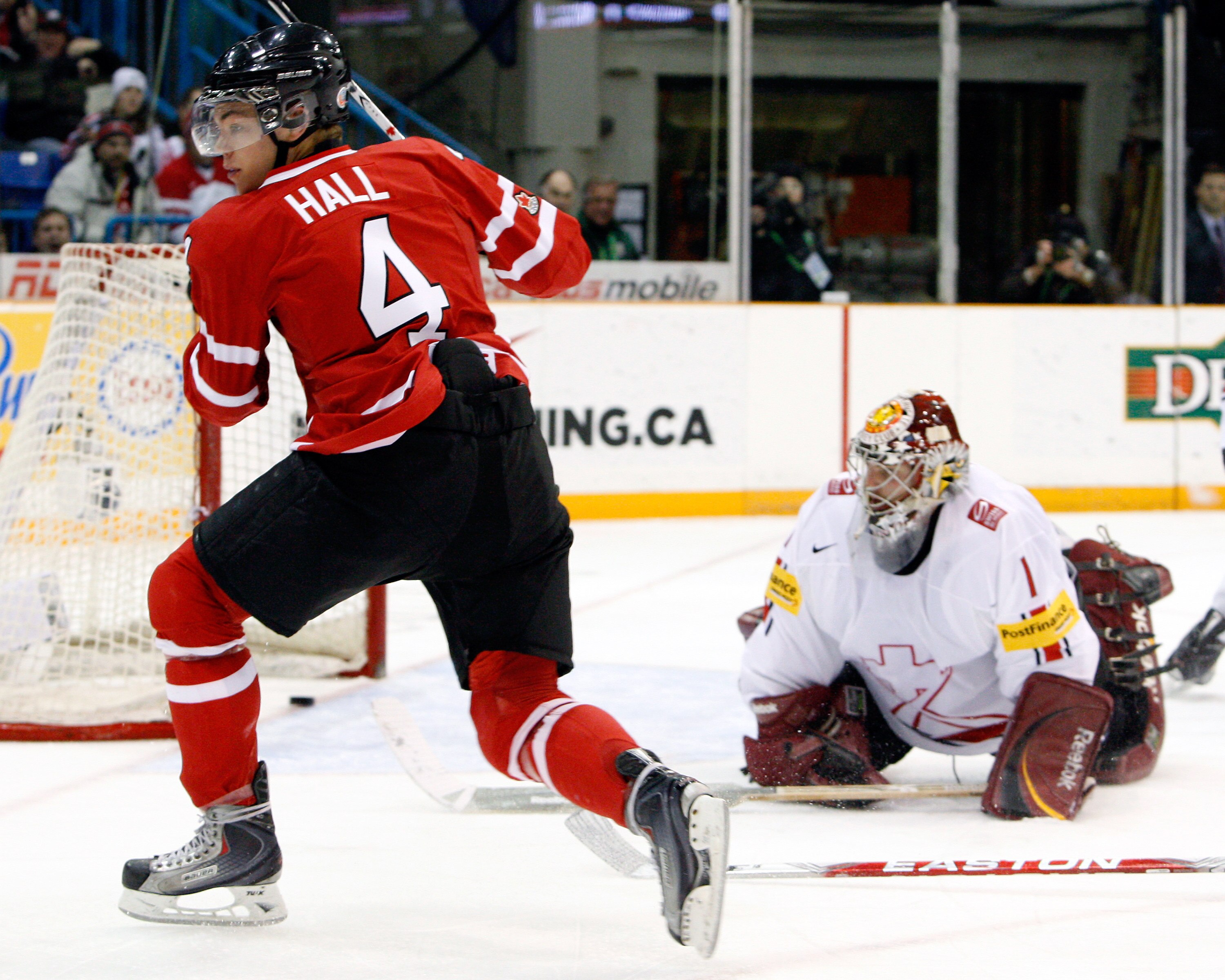 SASKATOON, SK - JANUARY 3:  Taylor Hall #4 of Team Canada scores a second period goal on Benjamin Conz #1 of Team Switzerland during the 2010 IIHF World Junior Championship Tournament Semifinal game on January 3, 2010 at the Credit Union Centre in Saskato