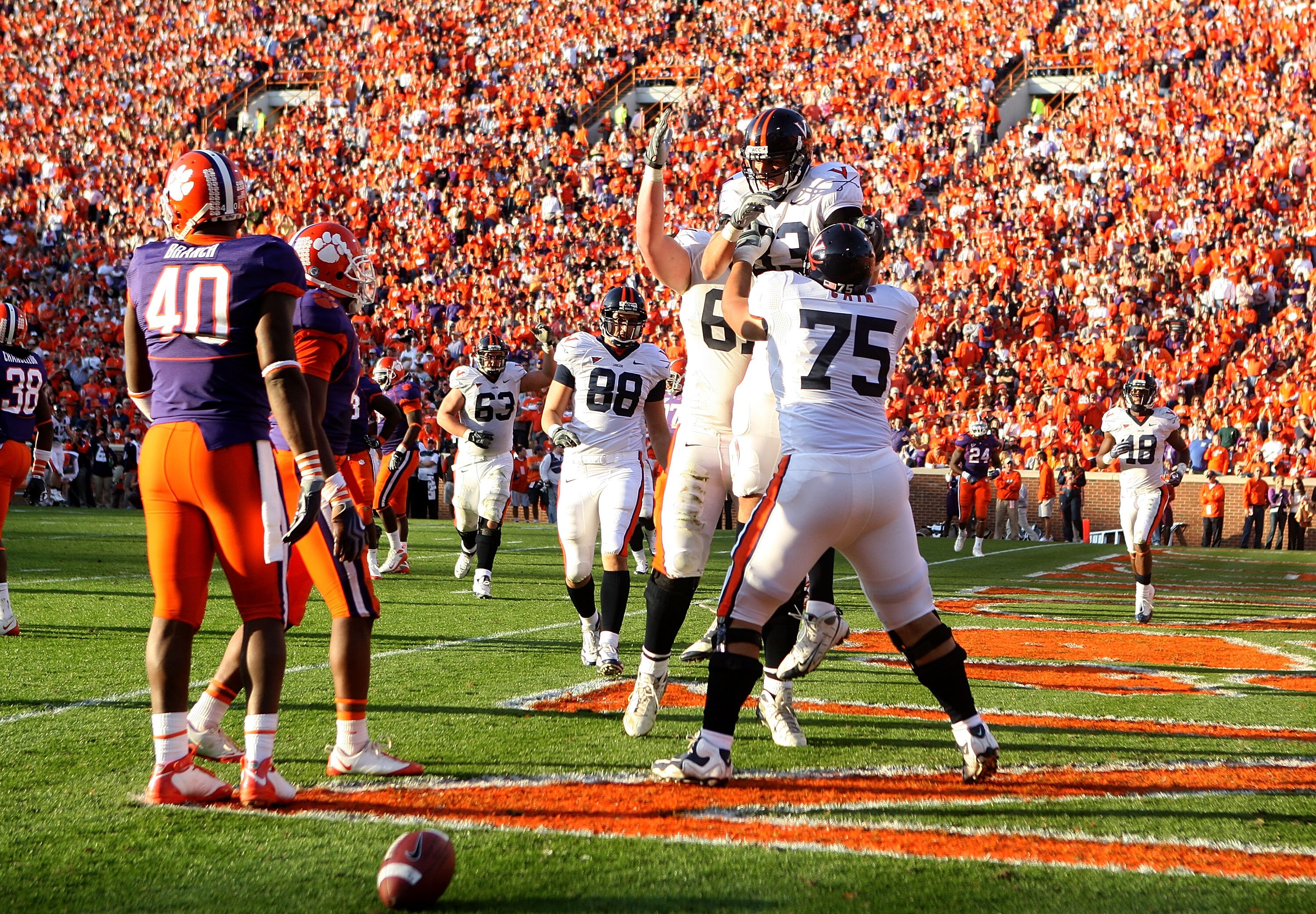 CLEMSON, SC - NOVEMBER 21:  Joe Torchia #83 of the Virginia Cavaliers celebrates with teammate Isaac Cain #75 after a touchdown against the Clemson Tigers during their game at Memorial Stadium on November 21, 2009 in Clemson, South Carolina.  (Photo by St