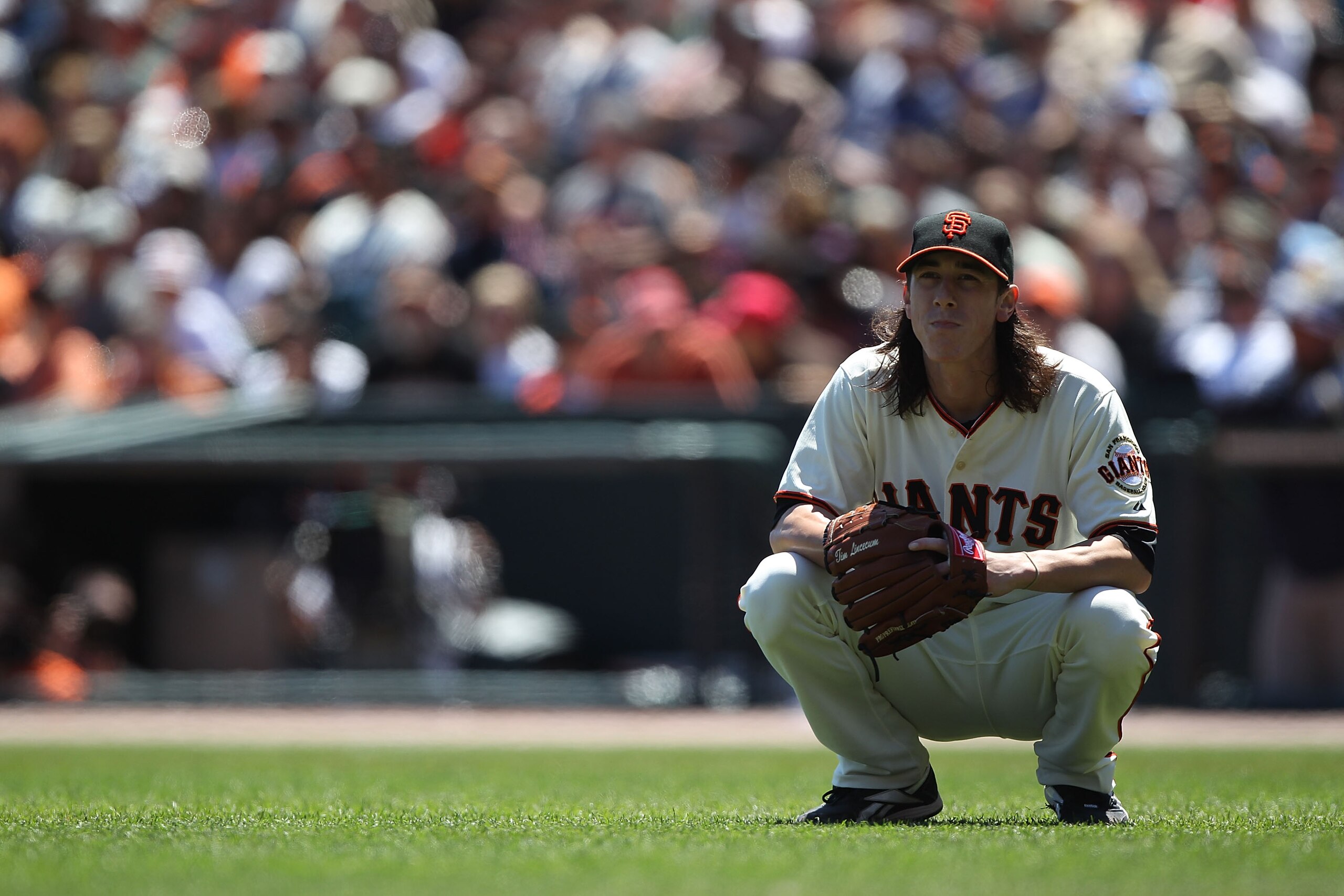SAN FRANCISCO - AUGUST 15:  Pitcher Tim Lincecum #55 of the San Francisco Giants looks on after giving up a single to Wade LeBlanc of the San Diego Padres in the second innning during an MLB game at AT&T Park on August 15, 2010 in San Francisco, Californi