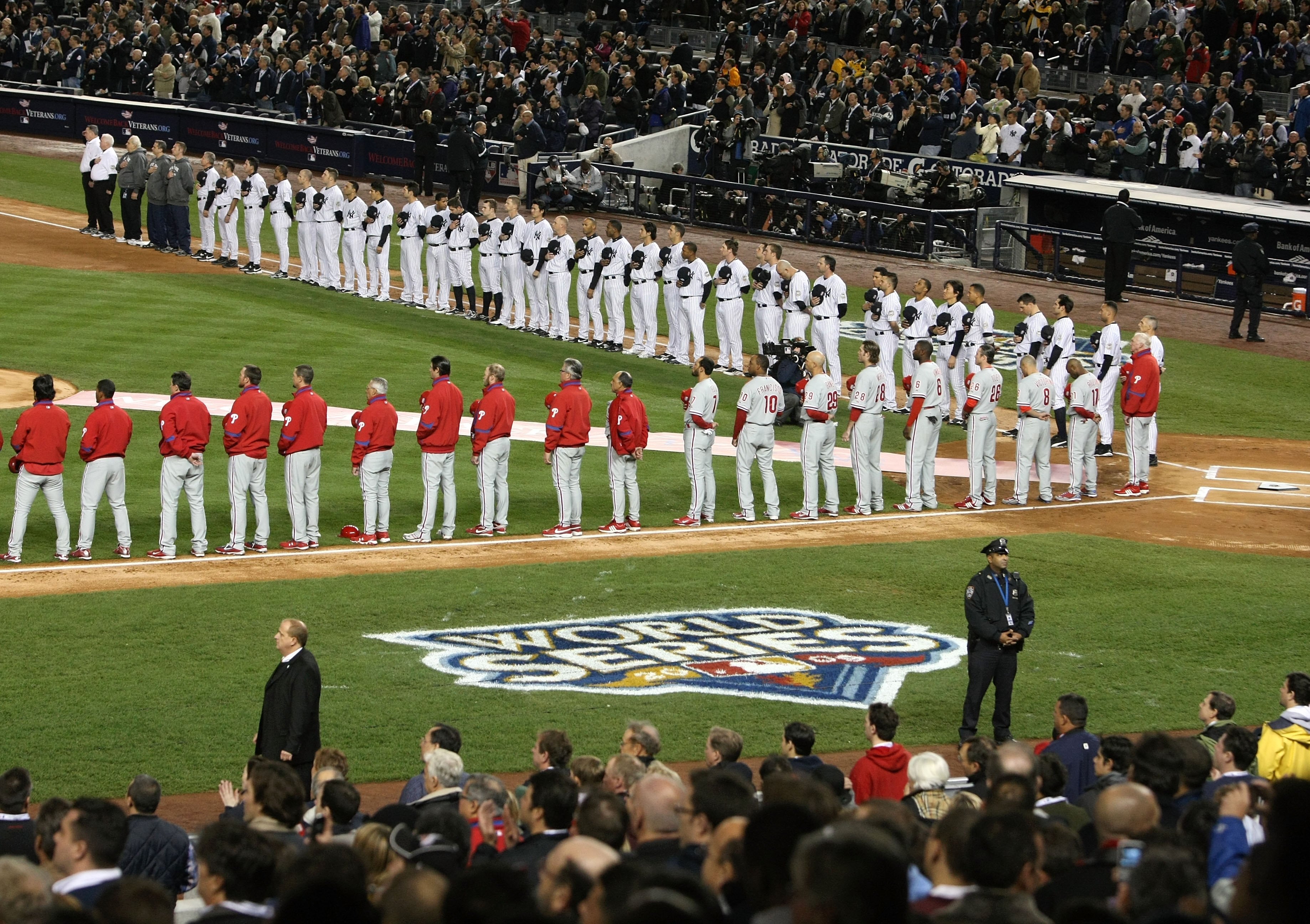 NEW YORK - OCTOBER 28:  A general view of the New York Yankees and the Philadelphia Phillies standing for the National Anthem prior to Game One of the 2009 MLB World Series at Yankee Stadium on October 28, 2009 in the Bronx borough of New York City.  (Pho