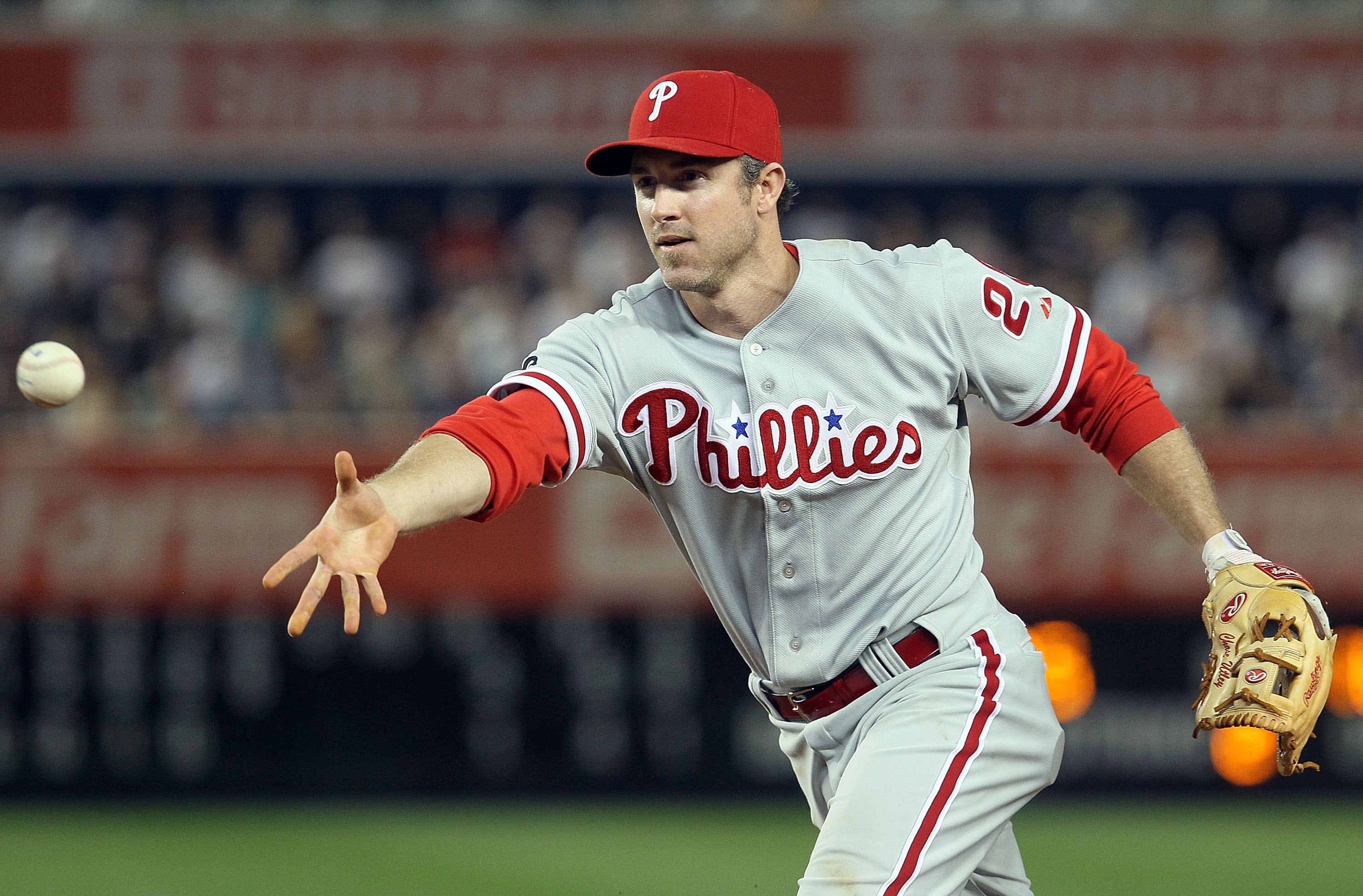 NEW YORK - JUNE 17:  Chase Utley #26 of the Philadelphia Phillies flips the ball to first base for the final out of the eigth inning against the New York Yankees on June 17, 2010 at Yankee Stadium in the Bronx borough of New York City. The Phillies defeat