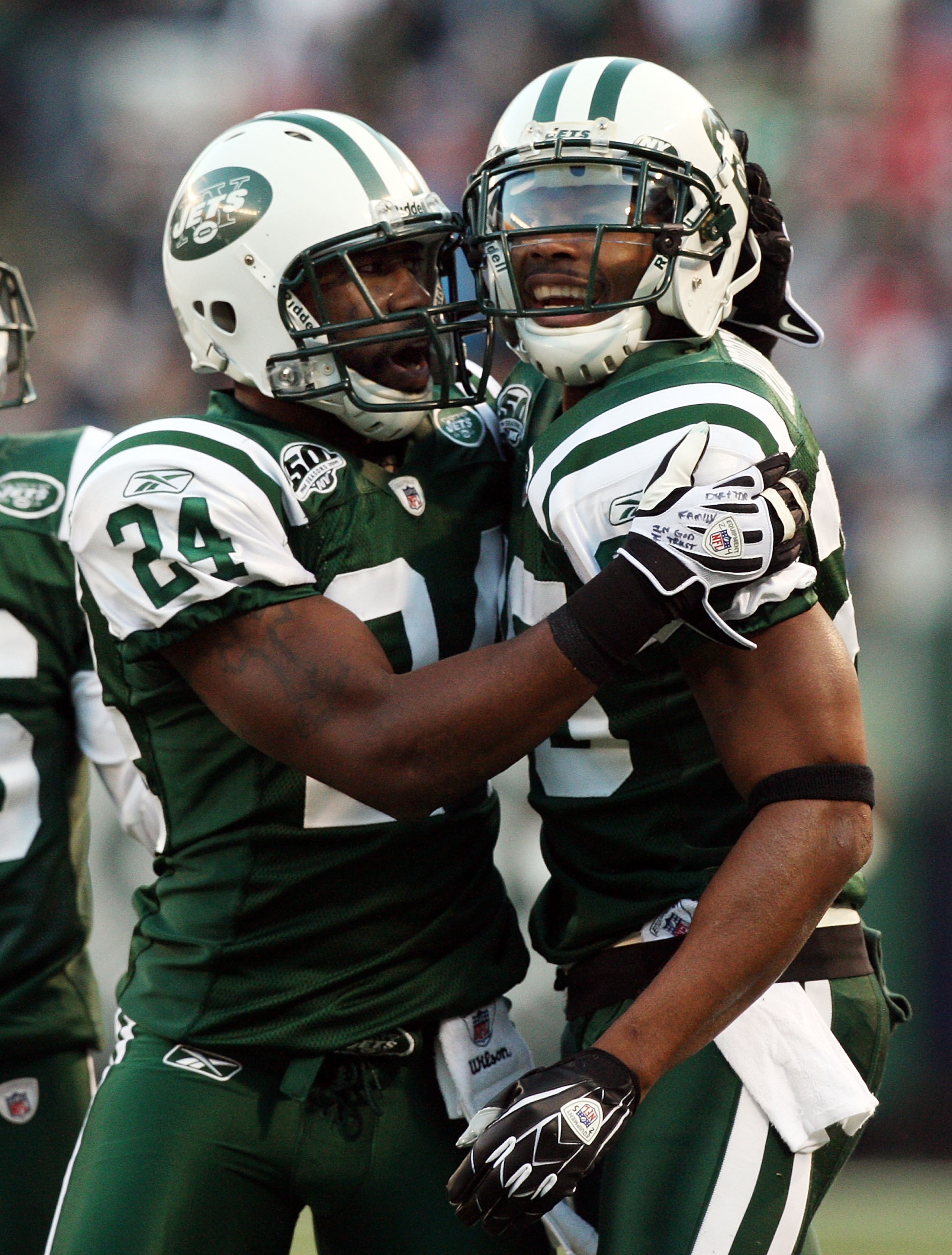 EAST RUTHERFORD, NJ - NOVEMBER 29:  Kerry Rhodes #25 of the New York Jets celebrates his second interception of the game against the Carolina Panthers with teammate Darrelle Revis #24 on November 29, 2009 at Giants Stadium in East Rutherford, New Jersey.