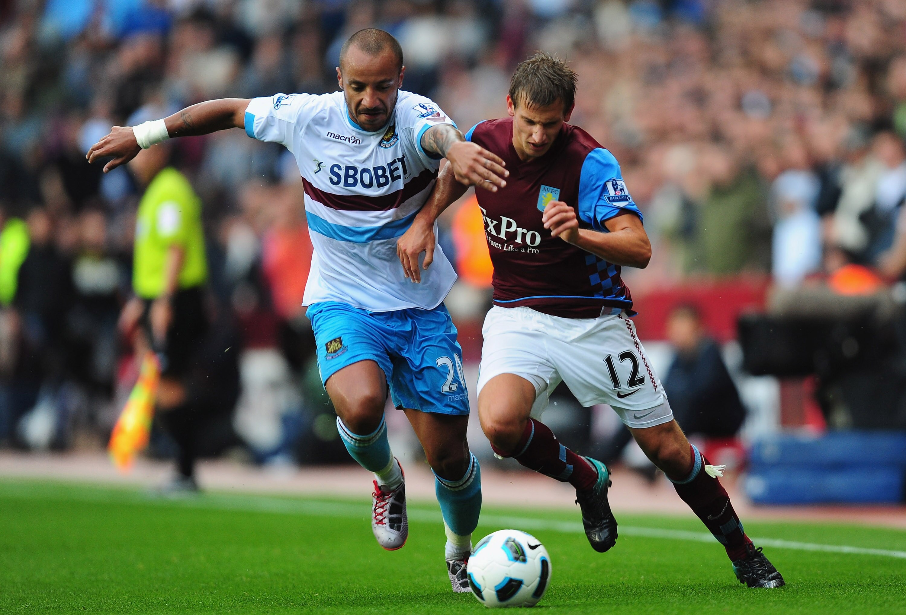 BIRMINGHAM, ENGLAND - AUGUST 14:  Marc Albrighton (R) of Aston Villa battles with Julien Faubert of West Ham United  during the Barclays Premier League match between Aston Villa and West Ham United at Villa Park on August 14, 2010 in Birmingham, England. 