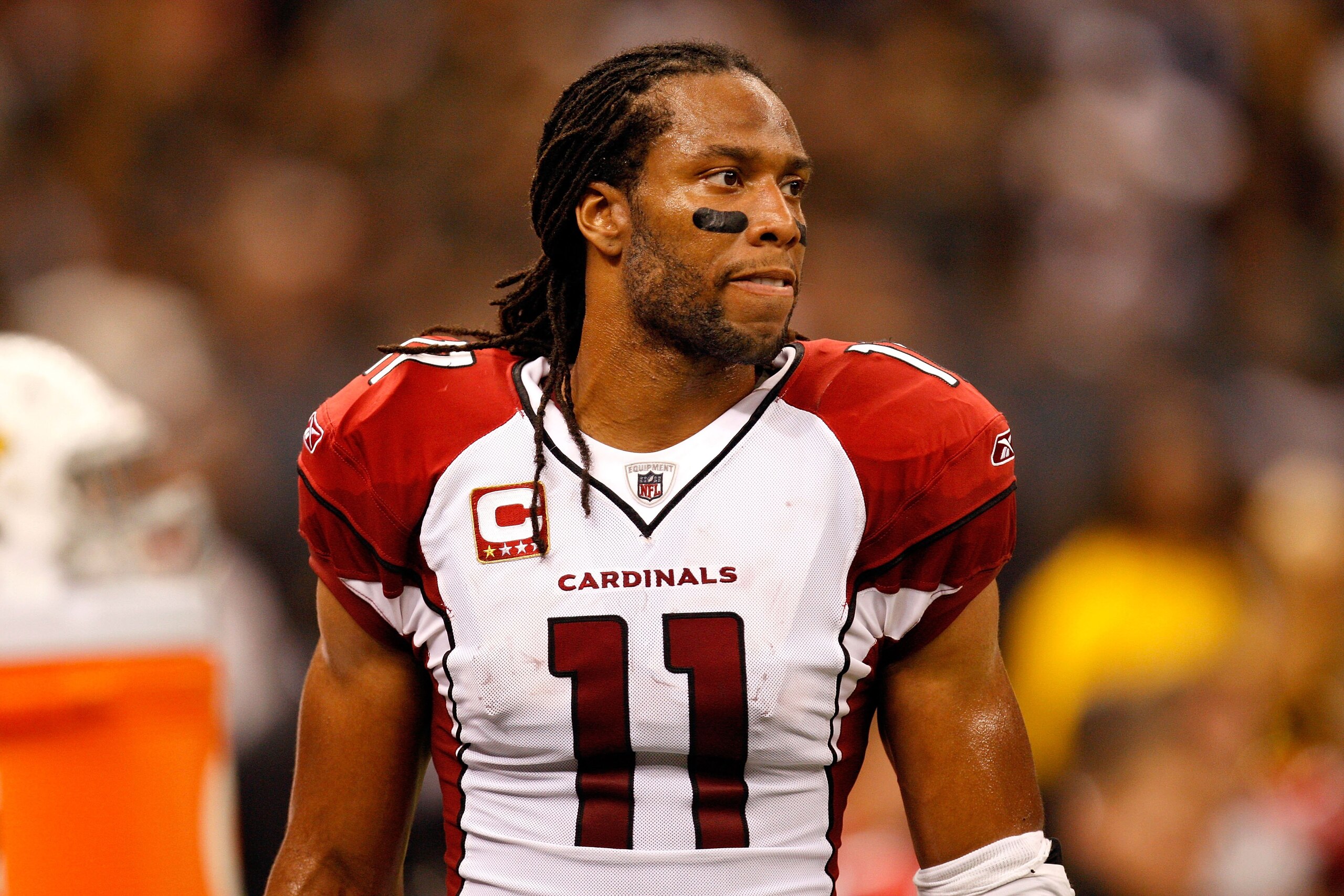 NEW ORLEANS - JANUARY 16:  Larry Fitzgerald #11 of the Arizona Cardinals looks on against the New Orleans Saints during the NFC Divisional Playoff Game at Louisana Superdome on January 16, 2010 in New Orleans, Louisiana. The Saints won 45-14.  (Photo by R