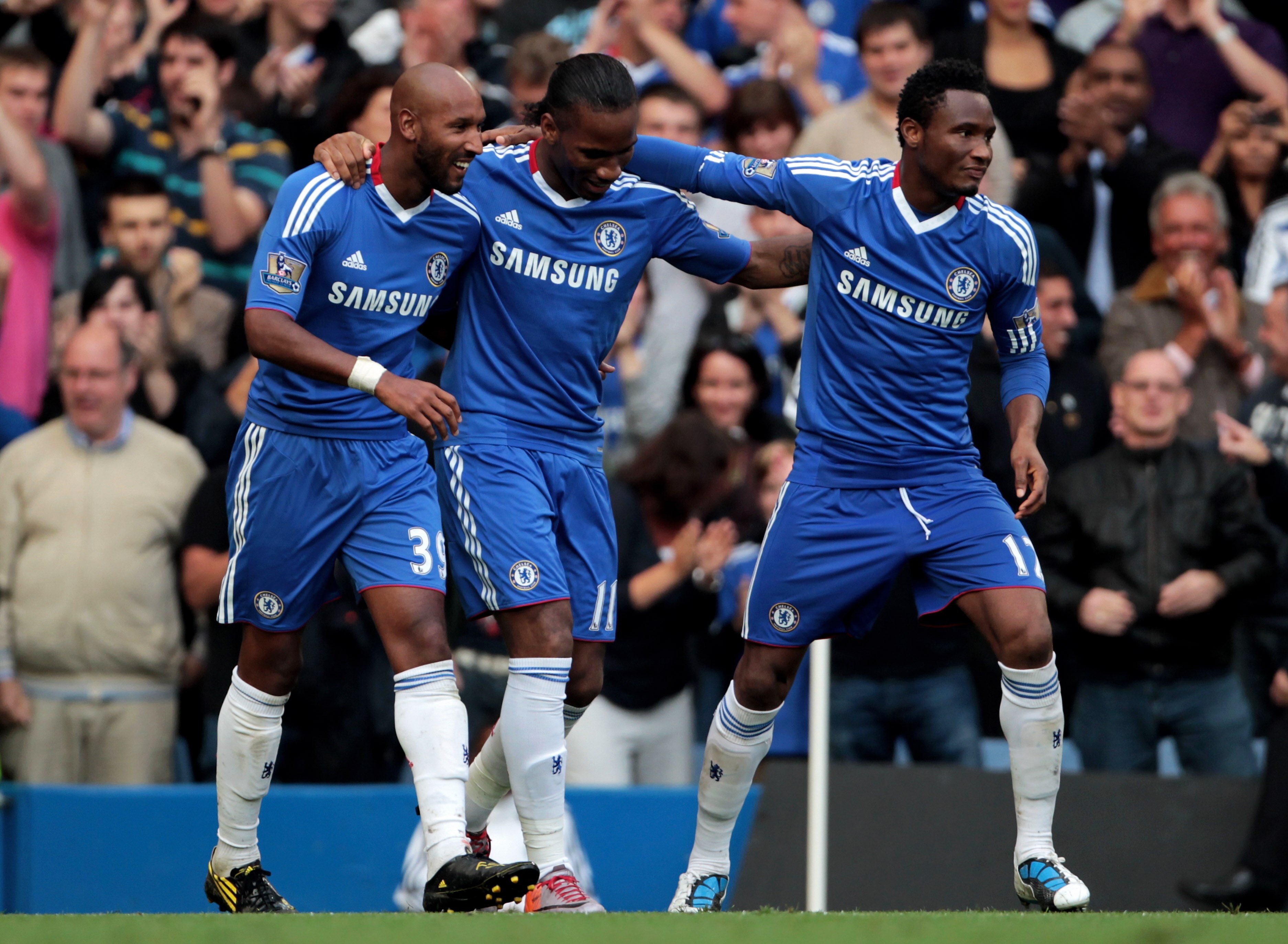 LONDON, ENGLAND - AUGUST 14:  Didier Drogba (C) of Chelsea is congratulated by teammates Nicolas Anelka (L) and John Obi Mikel (R) after scoring his team's third goal during the Barclays Premier League match between Chelsea and West Bromwich Albion at Sta