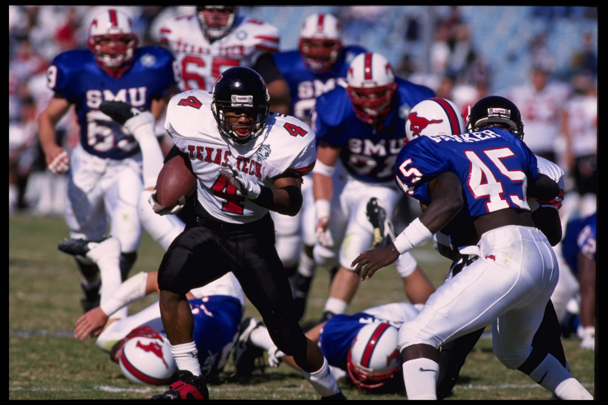 18 Nov 1995:  Running back Byron Hanspard #4 of the Texas Tech Red Raiders carries the football during the Red Raiders 44-14 victory over the SMU Mustangs at the Cotton Bowl in Dallas, Texas.  Mandatory Credit:  Robert Seale/Allsport