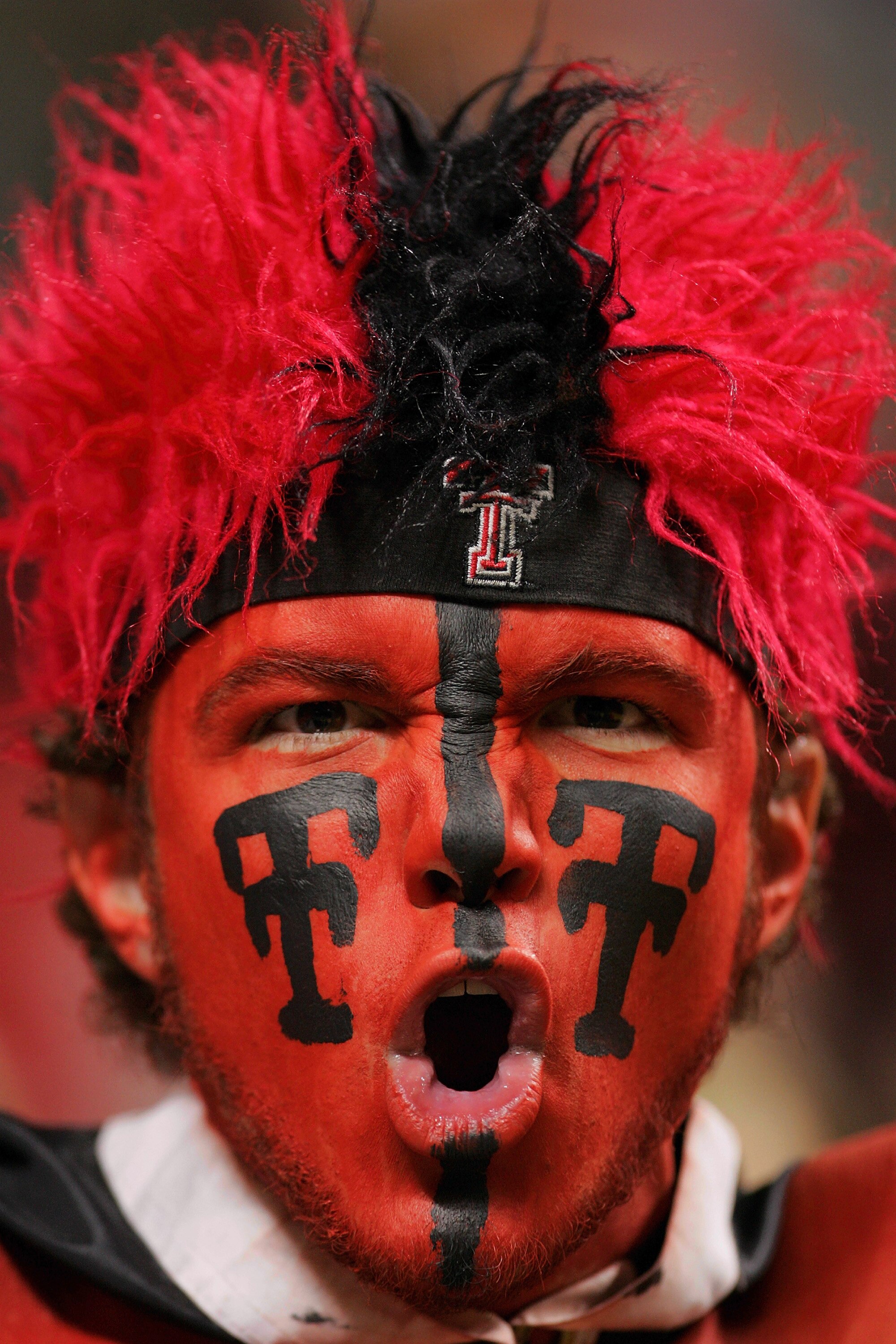 LUBBOCK, TX - JANUARY 8:  Armen Williams, a fan of the Texas Tech Red Raiders, yells during a game against the Oklahoma State Cowboys on January 8, 2005 at the United Spirit Arena in Lubbock, Texas.   (Photo by Ronald Martinez/Getty Images)