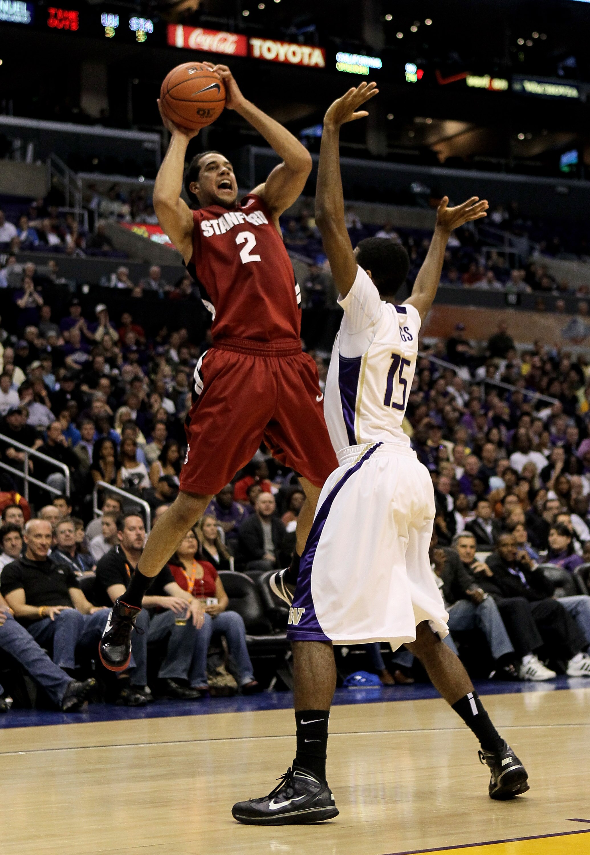 LOS ANGELES, CA - MARCH 12:  Landry Fields #2 of the Stanford Cardinal shoots over Scott Suggs #15 of the Washington Huskies during the semifinals of the Pac-10 Basketball Tournament at Staples Center on March 12, 2010 in Los Angeles, California.  (Photo