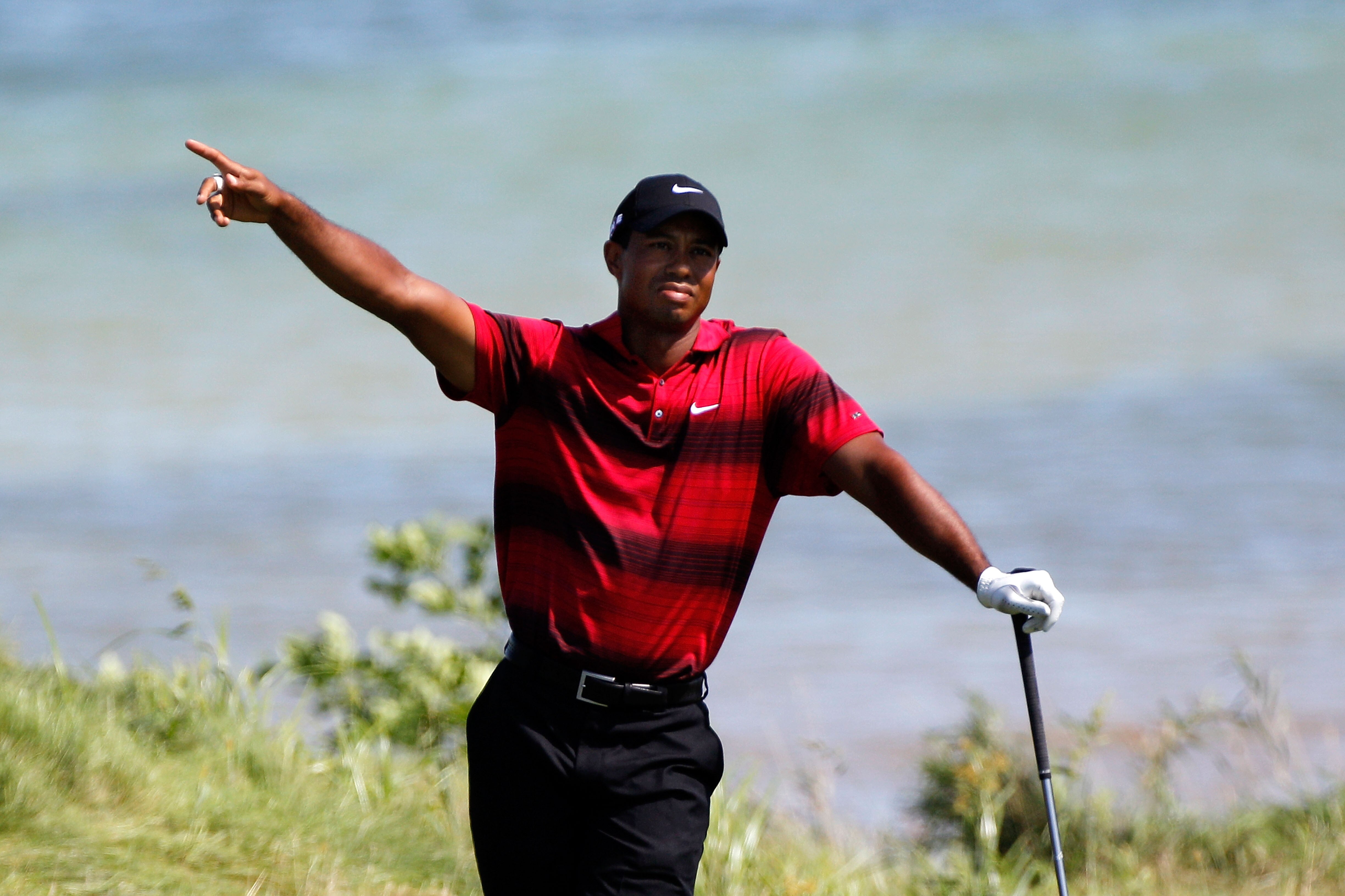 KOHLER, WI - AUGUST 15: Tiger Woods reacts to a shot on the 18th hole during the final round of the 92nd PGA Championship on the Straits Course at Whistling Straits on August 15, 2010 in Kohler, Wisconsin. (Photo by Sam Greenwood/Getty Images)