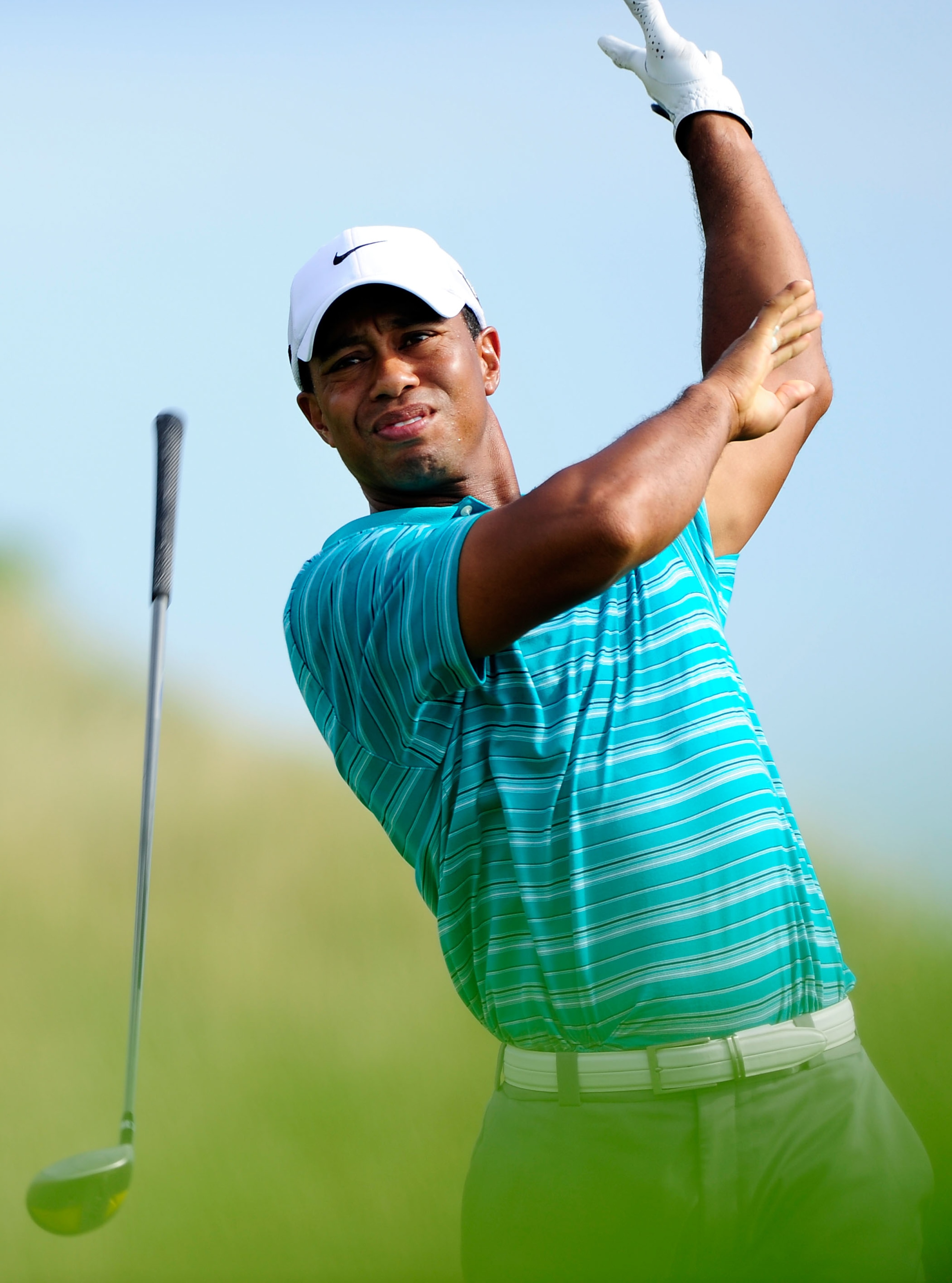 KOHLER, WI - AUGUST 14:  Tiger Woods reacts to a poor shot on the 14th hole during the continuation of the second round of the 92nd PGA Championship on the Straits Course at Whistling Straits on August 14, 2010 in Kohler, Wisconsin.  (Photo by Stuart Fran