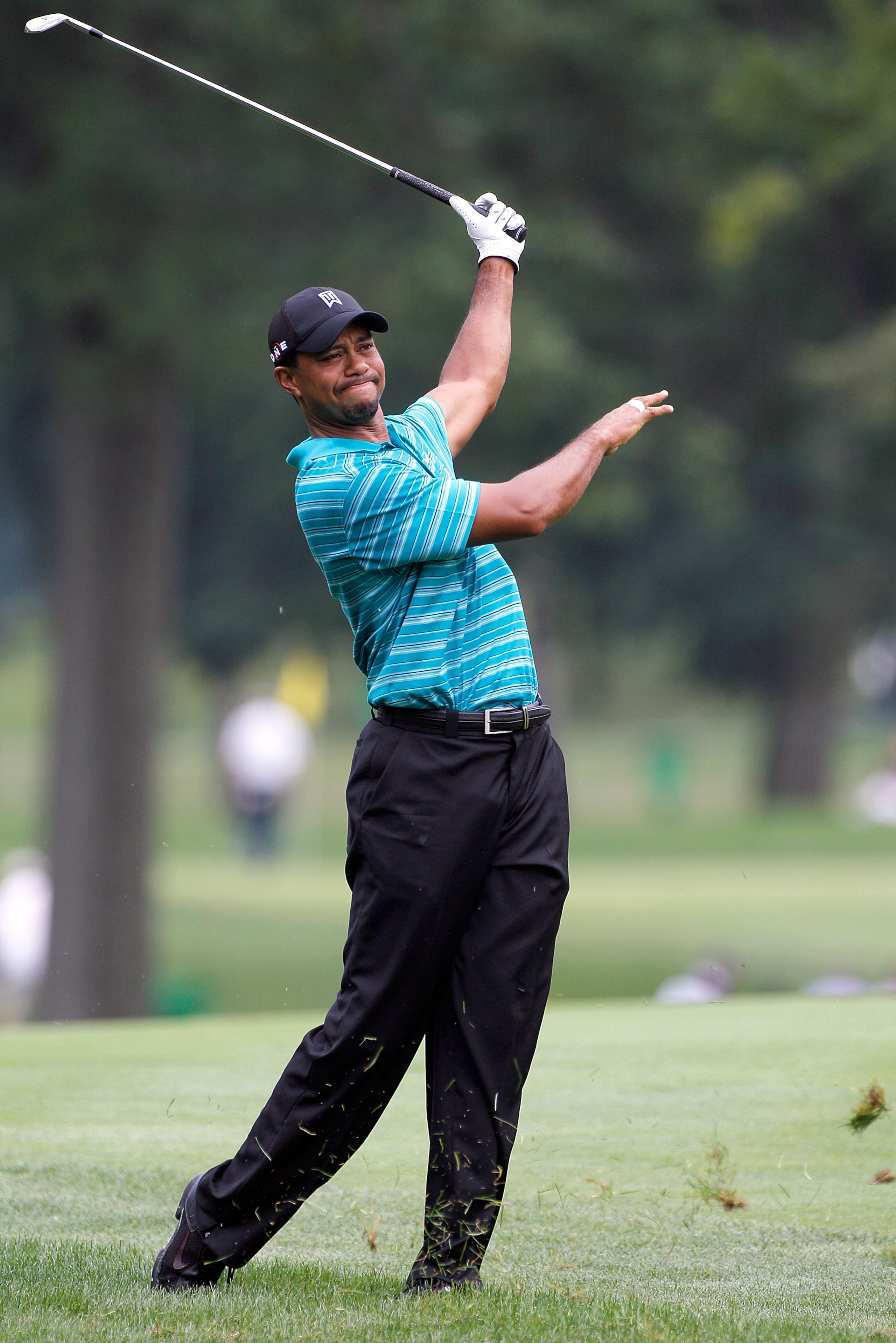 AKRON, OH - AUGUST 04:  Tiger Woods plays a shot during a practice round prior to the WGC- Bridgestone Invitational on the South Course at Firestone Country Club on August 4, 2010 in Akron, Ohio.  (Photo by Sam Greenwood/Getty Images)
