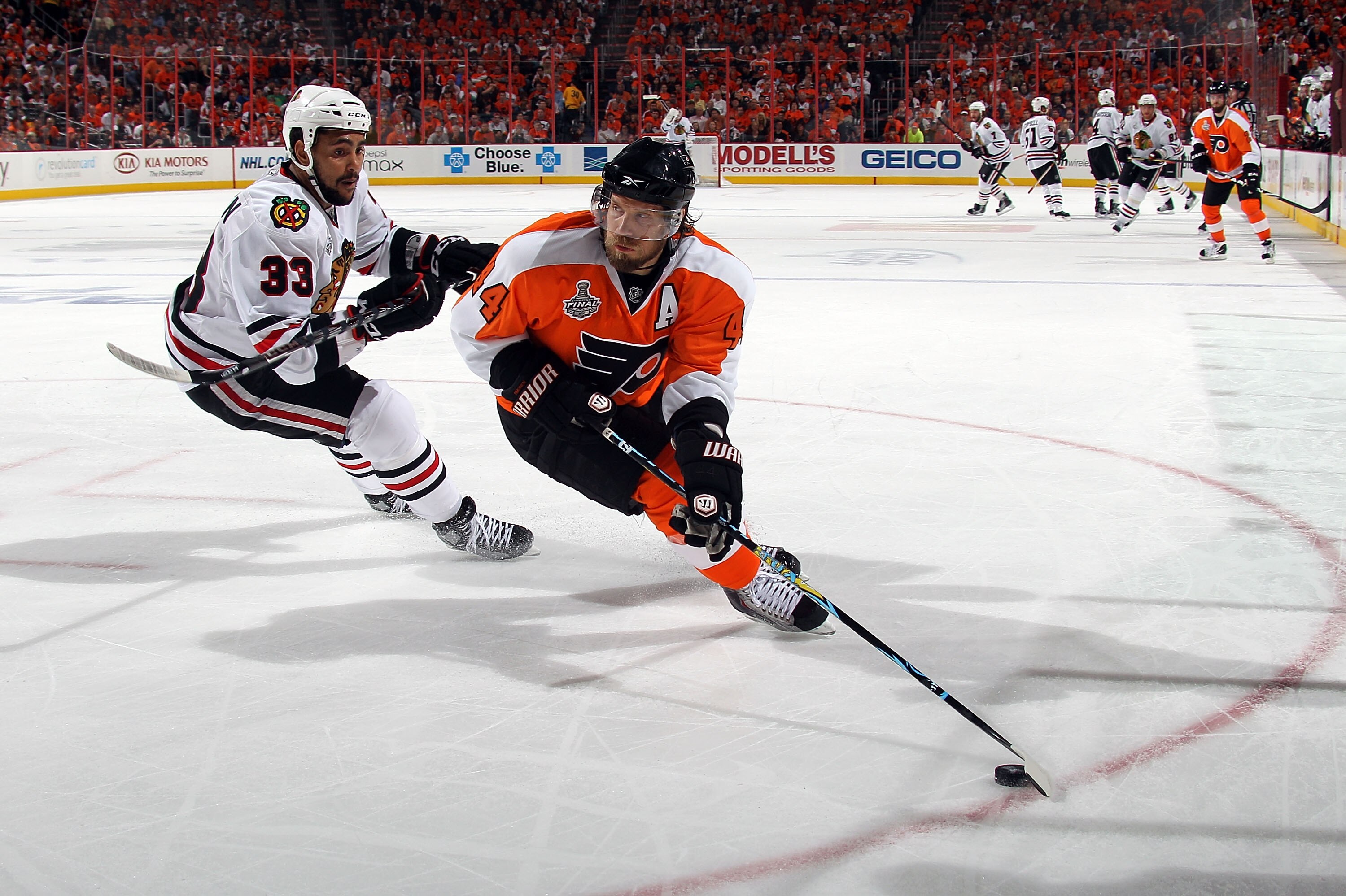 PHILADELPHIA - JUNE 09:  Kimmo Timonen #44 of the Philadelphia Flyers handles the puck against Dustin Byfuglien #33  in Game Six of the 2010 NHL Stanley Cup Final at the Wachovia Center on June 9, 2010 in Philadelphia, Pennsylvania.  (Photo by Bruce Benne