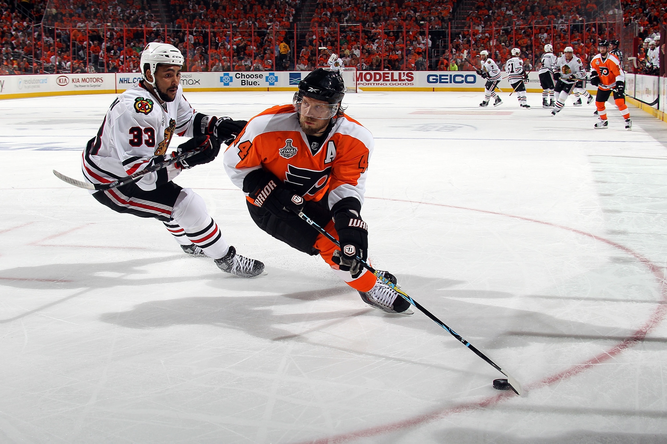 PHILADELPHIA - JUNE 09:  Kimmo Timonen #44 of the Philadelphia Flyers handles the puck against Dustin Byfuglien #33  in Game Six of the 2010 NHL Stanley Cup Final at the Wachovia Center on June 9, 2010 in Philadelphia, Pennsylvania.  (Photo by Bruce Benne