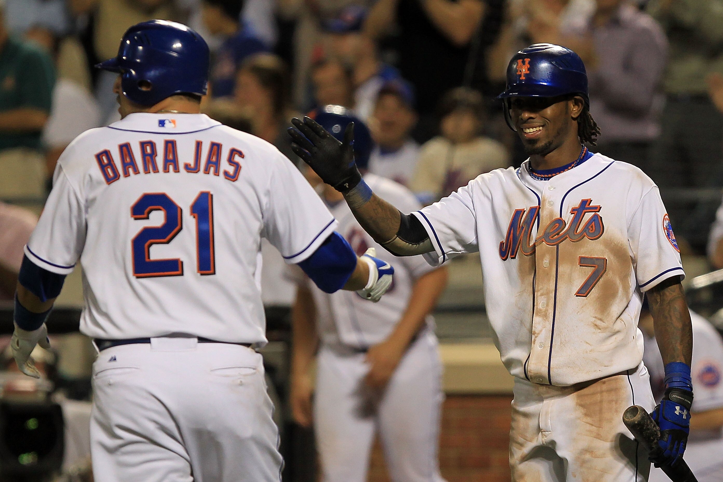 NEW YORK - MAY 25:  Jose Reyes #7 of the New York Mets celebrates as team mate Rod Barajas #21 scores against the Philadelphia Phillies on May 25, 2010 at Citi Field in the Flushing neighborhood of the Queens borough of New York City.  (Photo by Chris McG