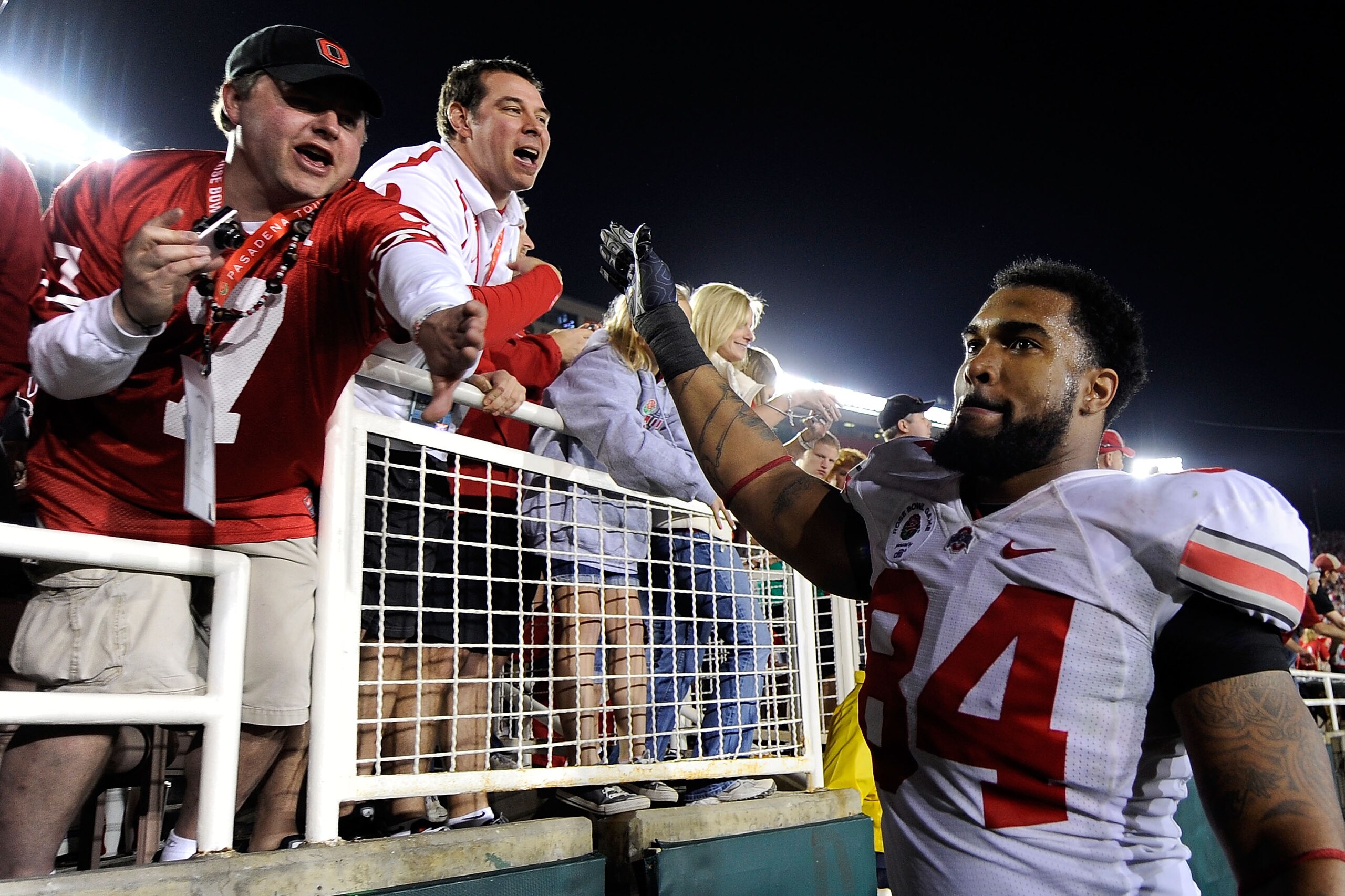PASADENA, CA - JANUARY 01:  Defensive lineman Doug Worthington #84 of the Ohio State Buckeyes celebrates with fans after the Buckeyes 26-17 win over the Oregon Ducks in the 96th Rose Bowl game on January 1, 2010 in Pasadena, California.  (Photo by Kevork