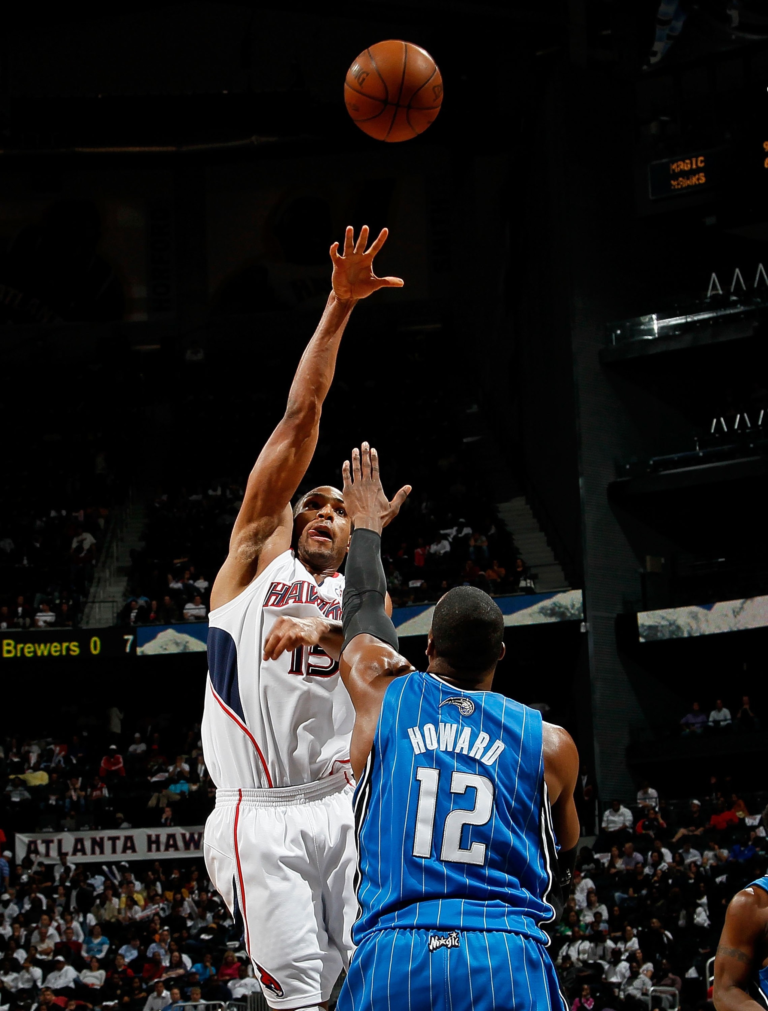 ATLANTA - MAY 10:  Al Horford #15 of the Atlanta Hawks against Dwight Howard #12 of the Orlando Magic during Game Four of the Eastern Conference Semifinals of the 2010 NBA Playoffs at Philips Arena on May 10, 2010 in Atlanta, Georgia.  NOTE TO USER: User 