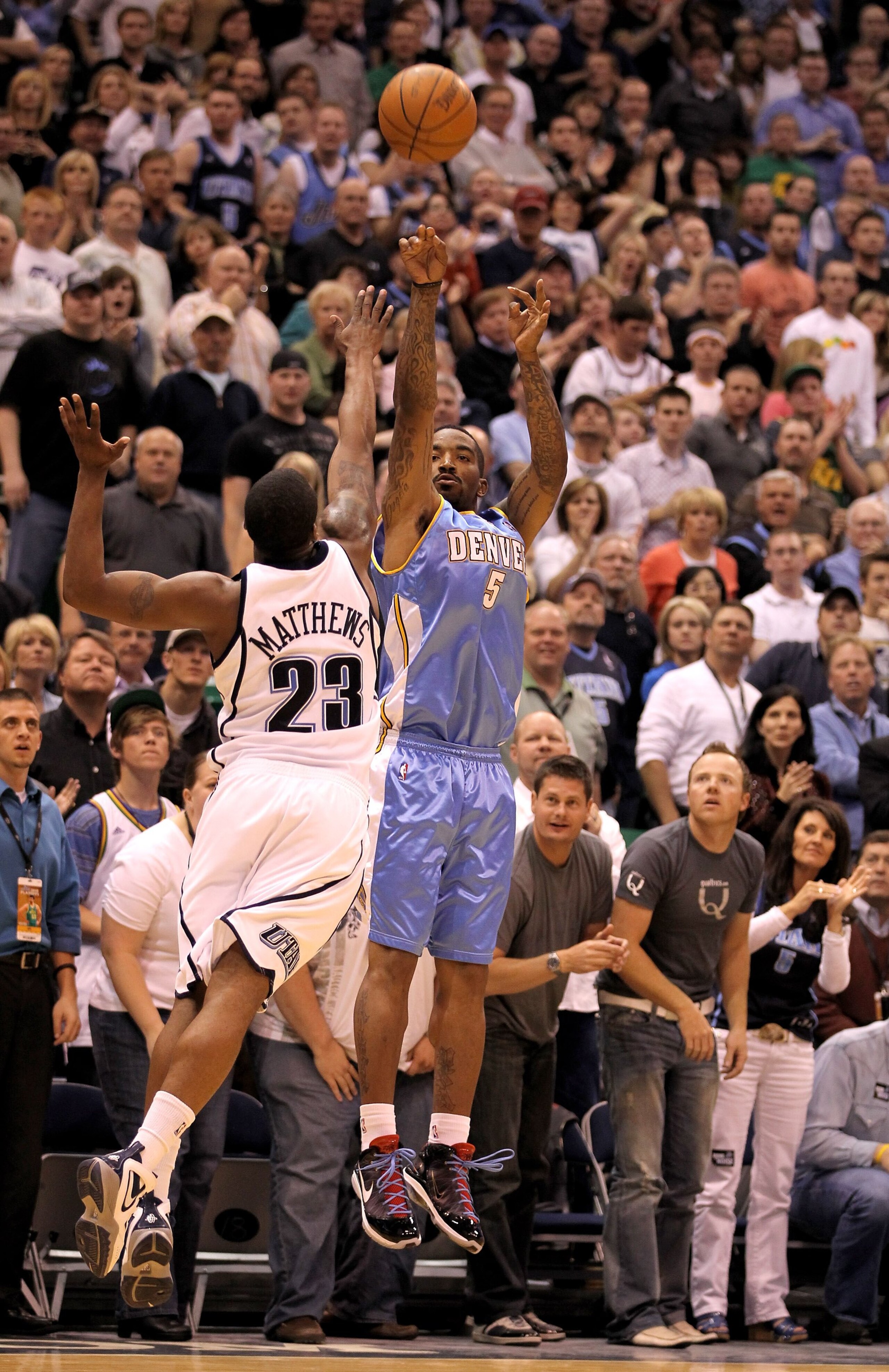 SALT LAKE CITY - APRIL 30:  J.R. Smith #5 of the Denver Nuggets shoots over Wesley Matthews #23 of the Utah Jazz in Game Six of the Western Conference Quarterfinals of the 2010 NBA Playoffs at EnergySolutions Arena on April 30, 2010 in Salt Lake City, Uta